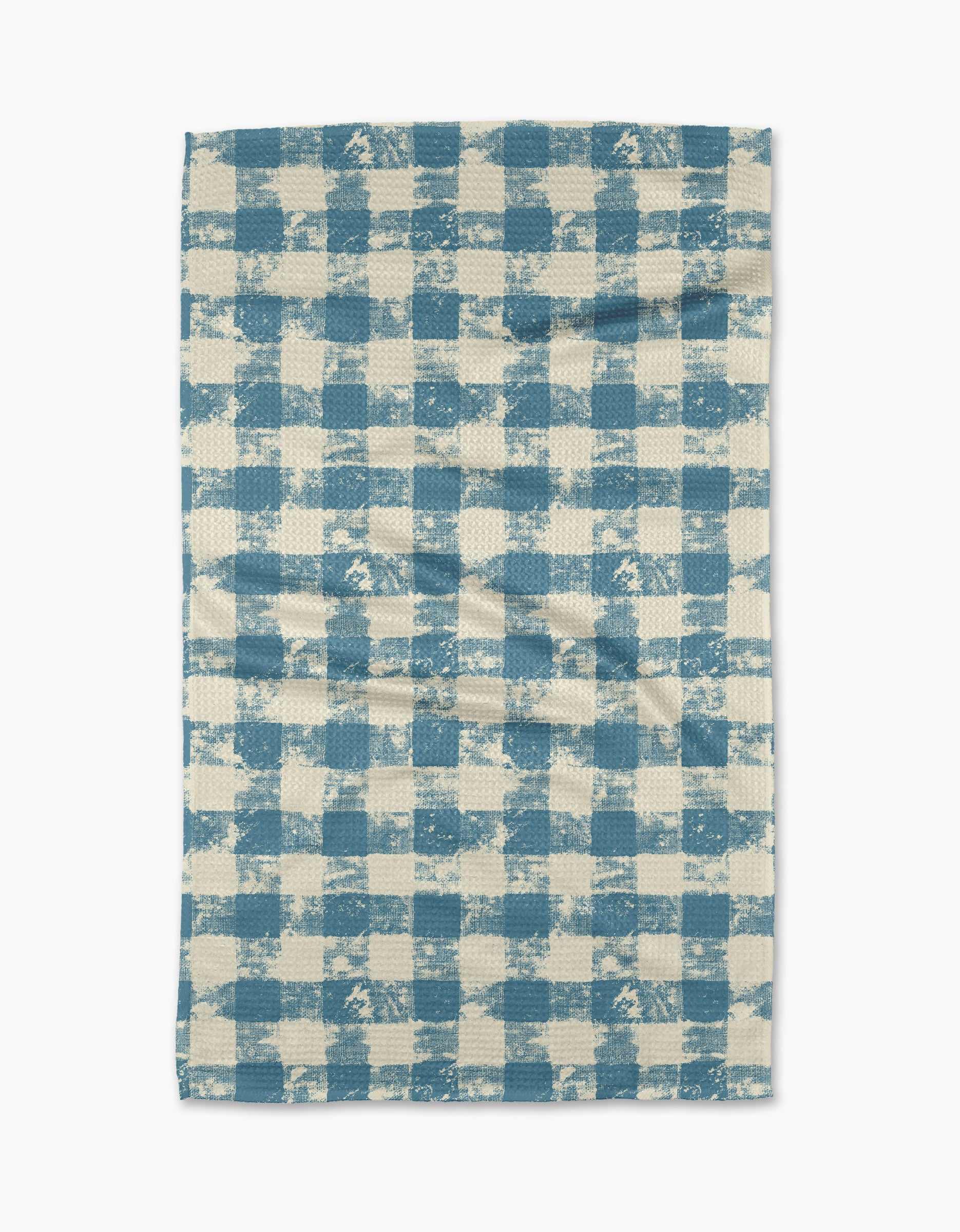 The Patch Denim tea towel by Geometry features a blue and white checkered pattern with a textured, slightly uneven design, displayed flat on a white background.