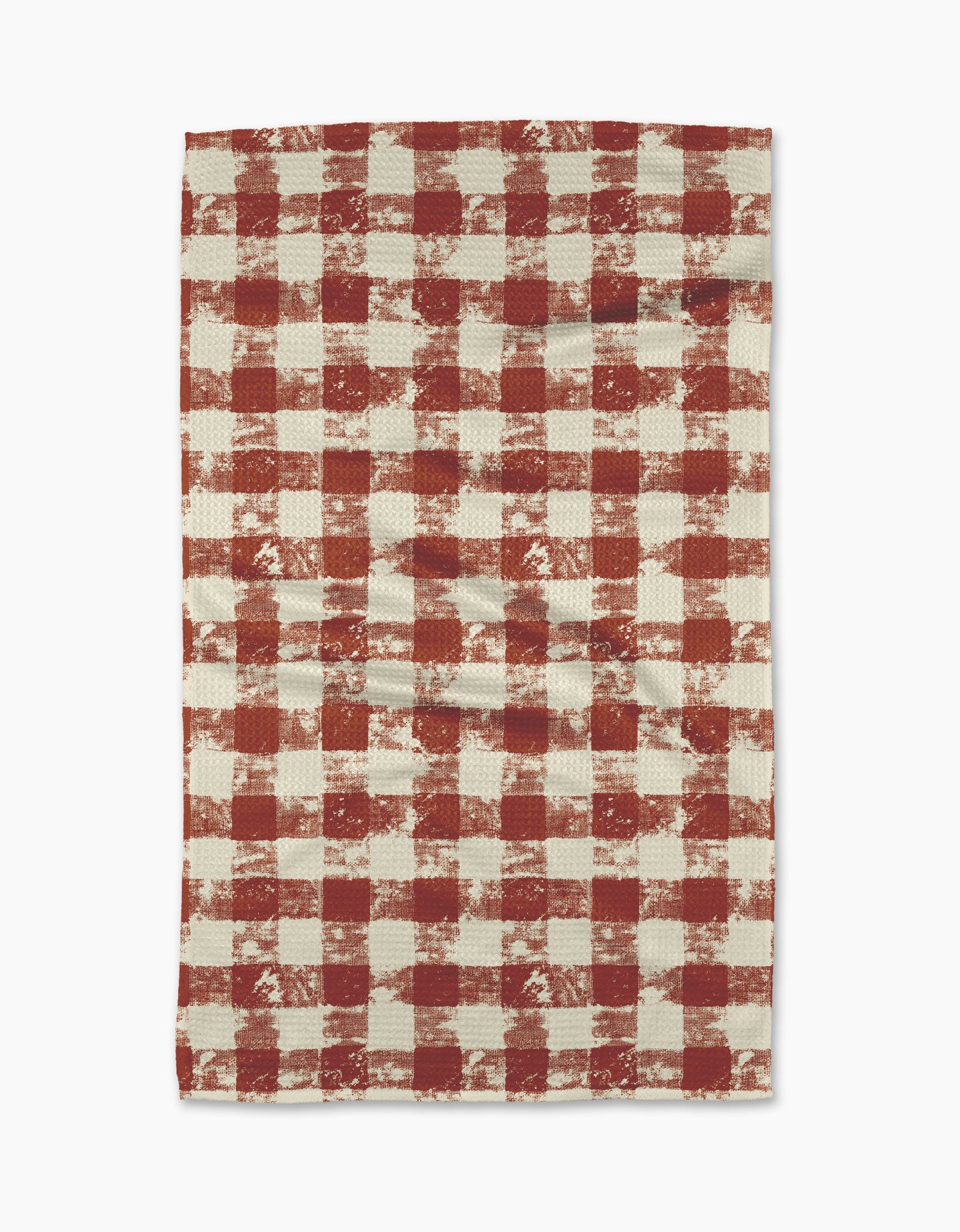 The Geometry Patch Spice tea towel features a red and white checkered pattern with a rustic, textured look. Ultra-absorbent and laid flat on a white background, its both stylish and functional for your kitchen.