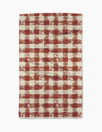 The Geometry Patch Spice tea towel features a red and white checkered pattern with a rustic, textured look. Ultra-absorbent and laid flat on a white background, its both stylish and functional for your kitchen.
