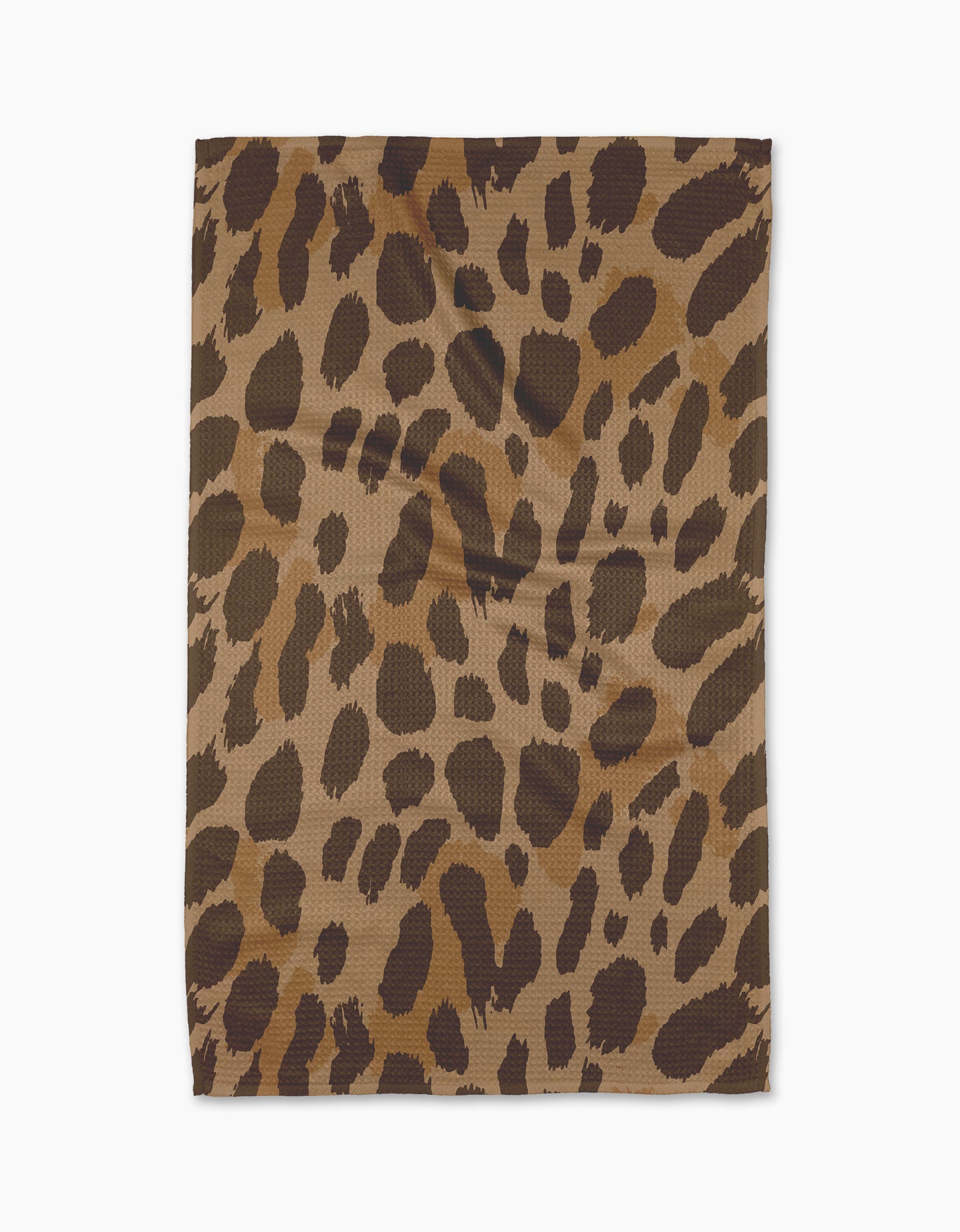 The Geometry Roam tea towel, crafted from recycled materials and showcasing a brown and black leopard print, is displayed flat on a white background.
