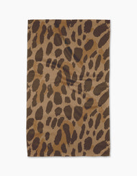 The Geometry Roam tea towel, crafted from recycled materials and showcasing a brown and black leopard print, is displayed flat on a white background.
