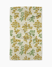 The Geometry Sonnet Butter tea towel features a cream base with green and mustard floral clusters, offering a textured, ultra-absorbent design perfect for everyday use.