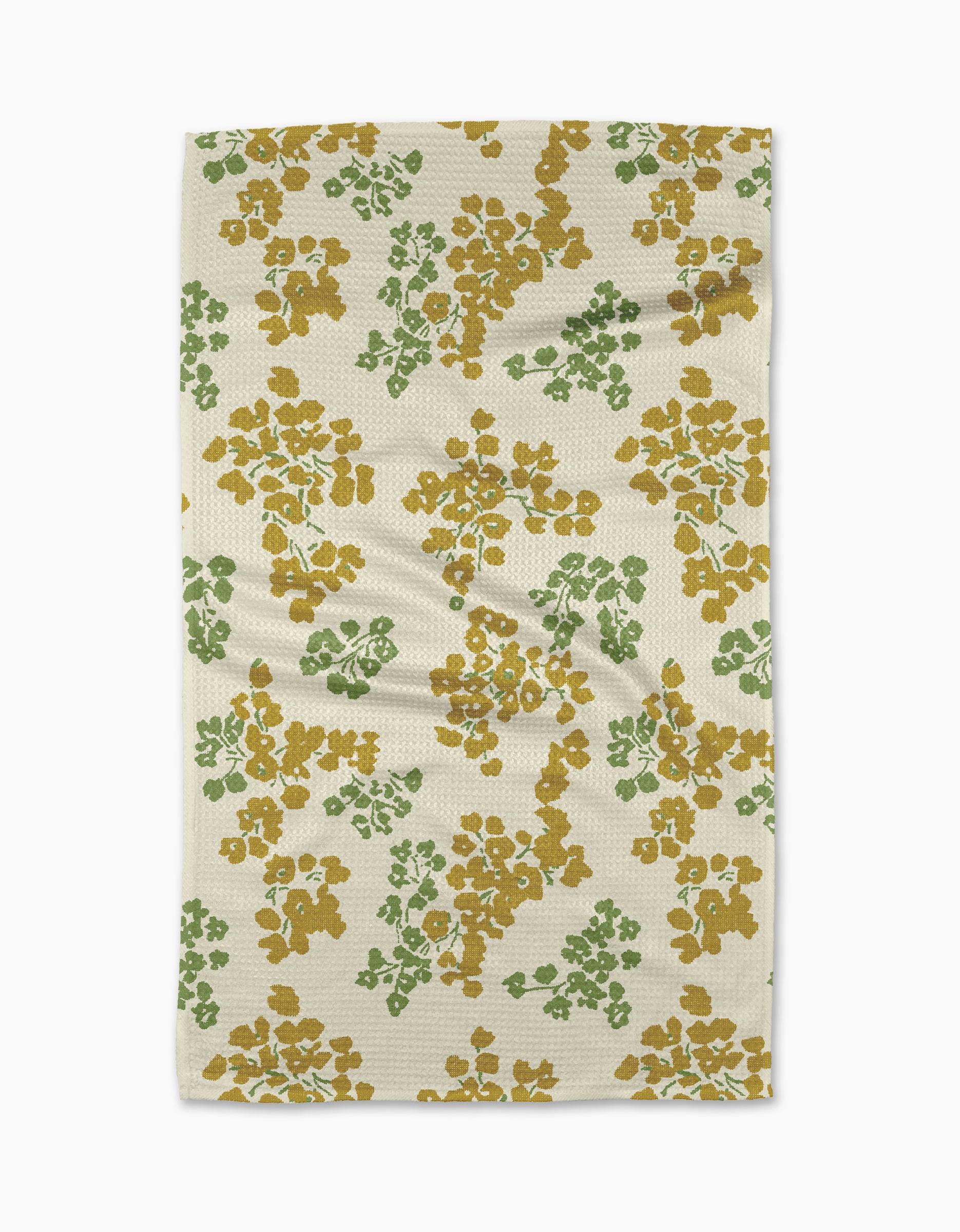 The Geometry Sonnet Butter tea towel features a cream base with green and mustard floral clusters, offering a textured, ultra-absorbent design perfect for everyday use.