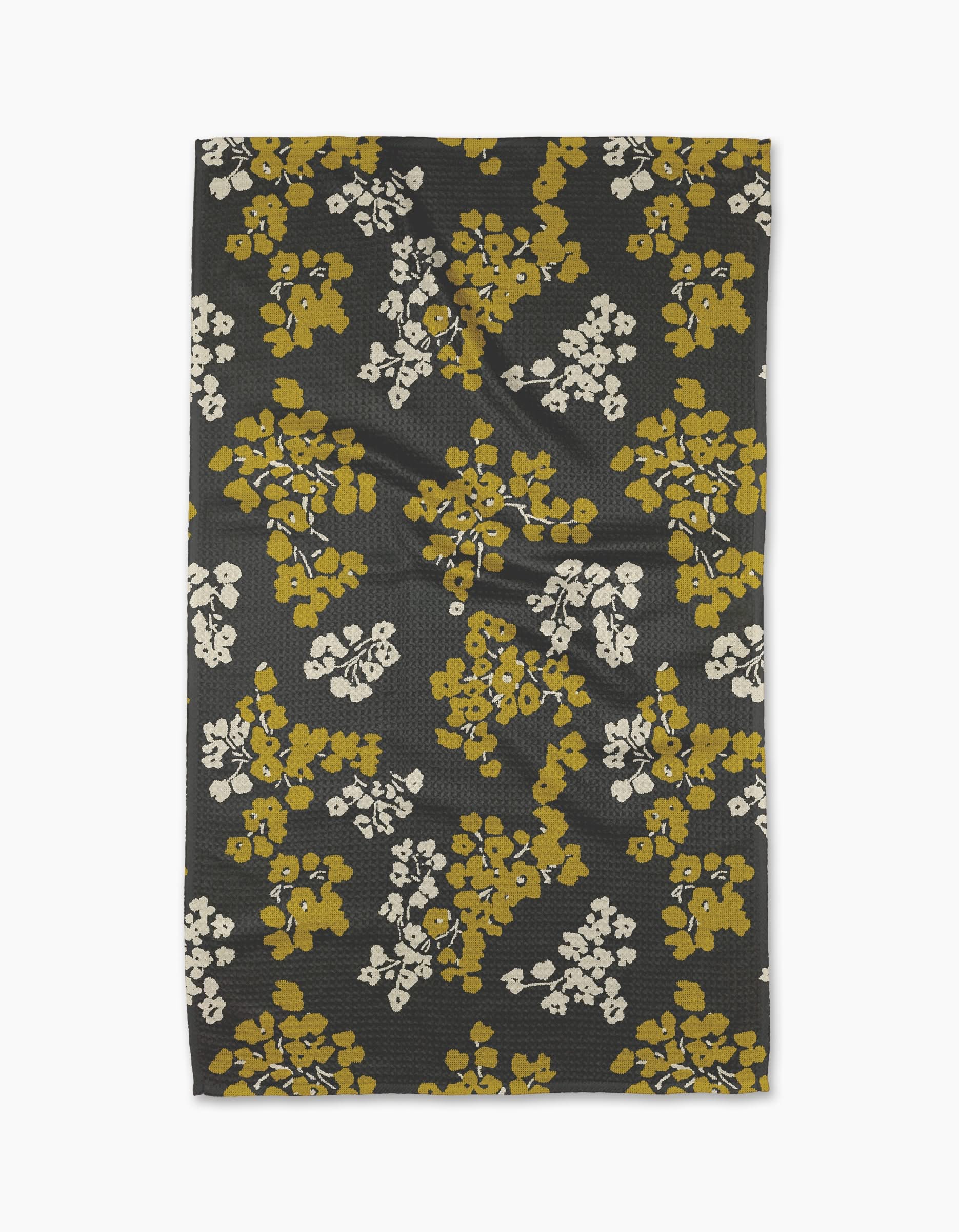 Geometry’s Sonnet Ember tea towel features a black background with mustard yellow and white floral clusters. Made from recycled materials, it’s a stylish and eco-friendly choice for your kitchen.