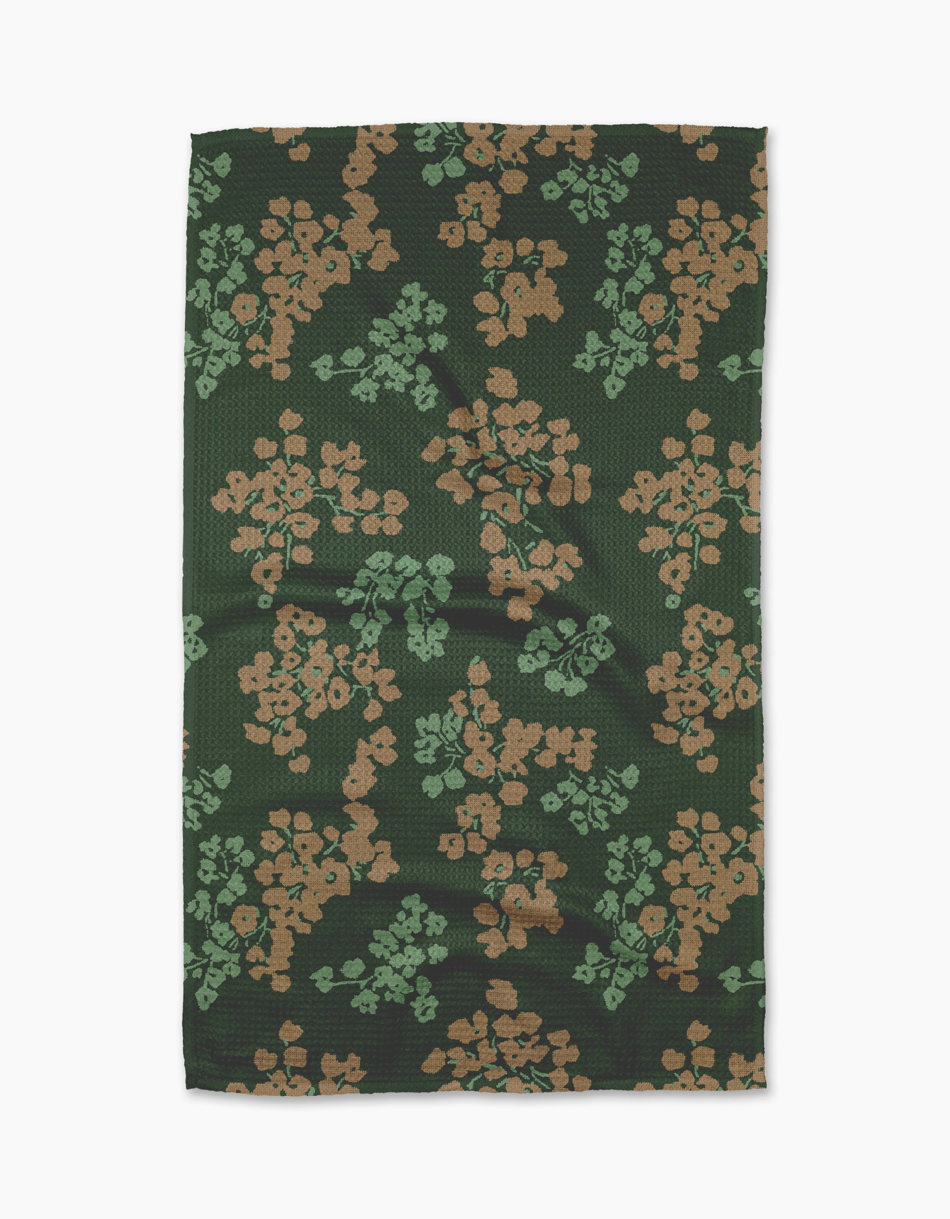The Geometry Sonnet Forest tea towel features a rectangular shape in dark green with tan and light green floral clusters. Ultra-absorbent, it’s shown laid flat on a white background.