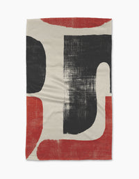 Sway by Geometry is an ultra-absorbent towel with a cream background and bold black and rust-red geometric shapes, featuring rough, textured edges—perfect for adding modern, artistic flair to any space.