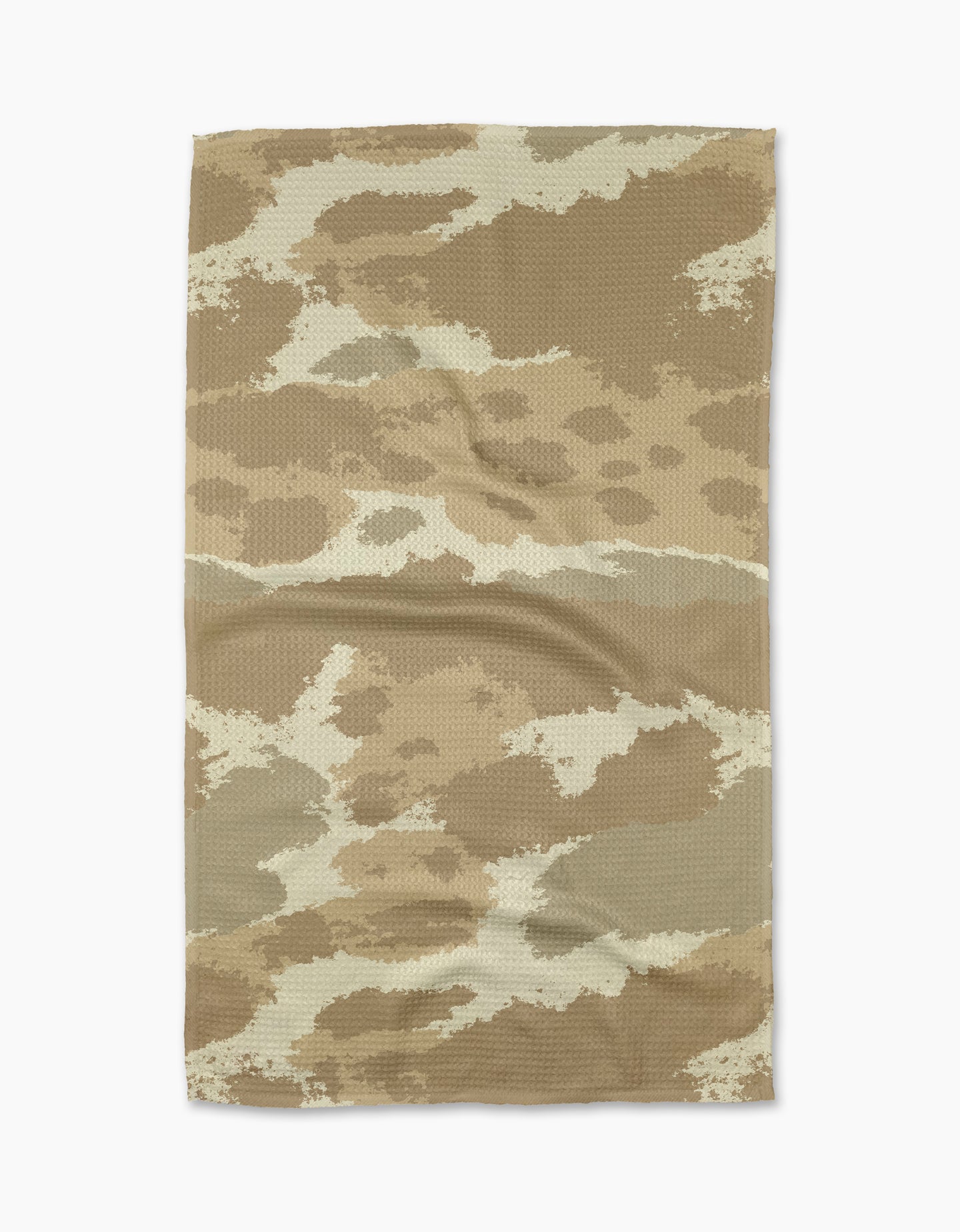 The Geometry Tarn Tan tea towel, featuring a tan and brown camouflage pattern, is laid flat on a white background. Wrinkles and fabric texture are visible.