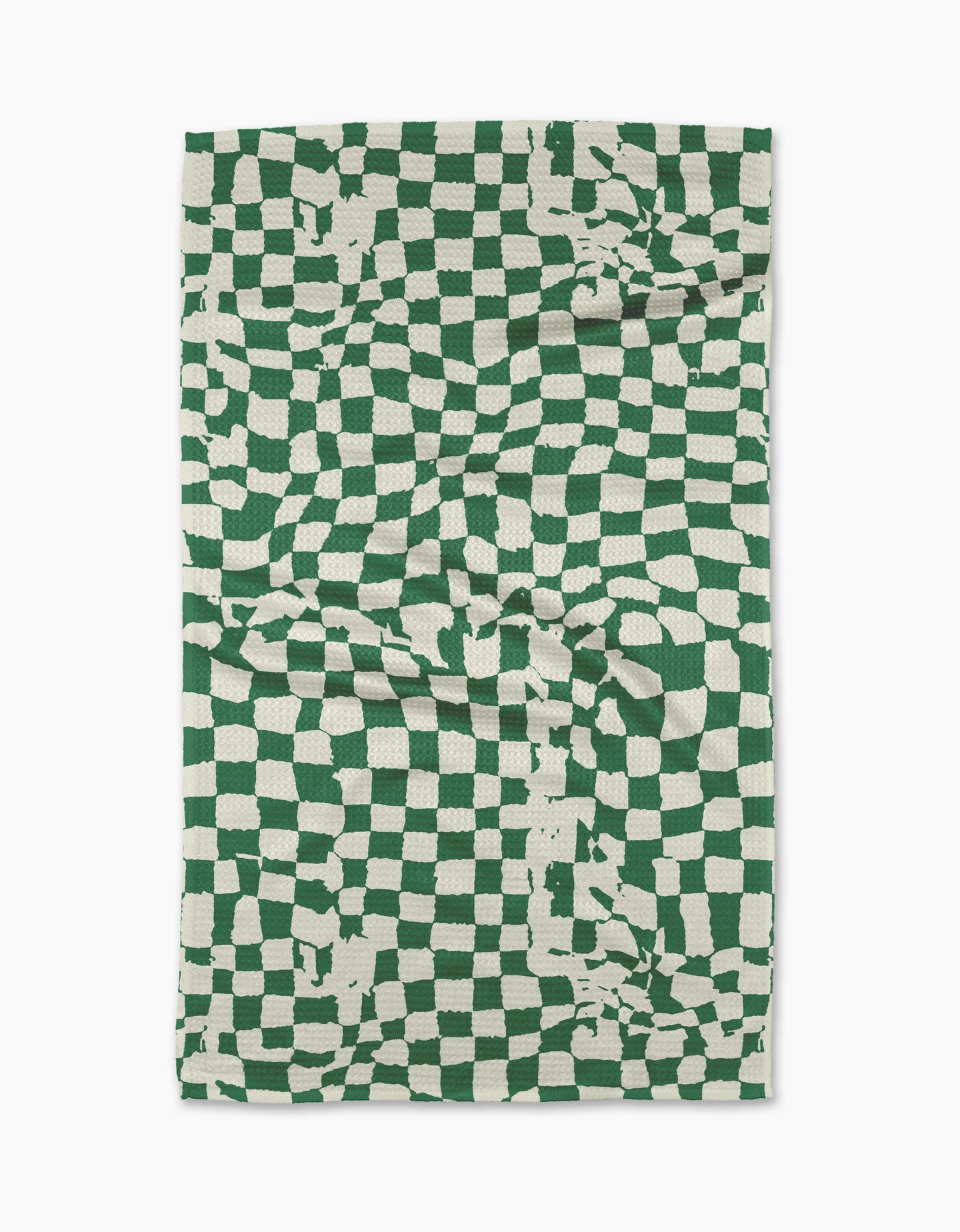 The Geometry Verdant tea towel is a rectangular, eco-friendly towel featuring a green and white distorted checkerboard with irregular lines and random splotches. Made from absorbent fabric, it’s shown slightly creased against a white background.