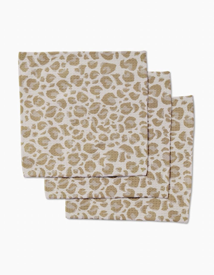 Three GEOMETRY Light Leopard napkins, made with ultra-absorbent Geoweave technology and a beige/tan leopard print, are arranged on a white background.