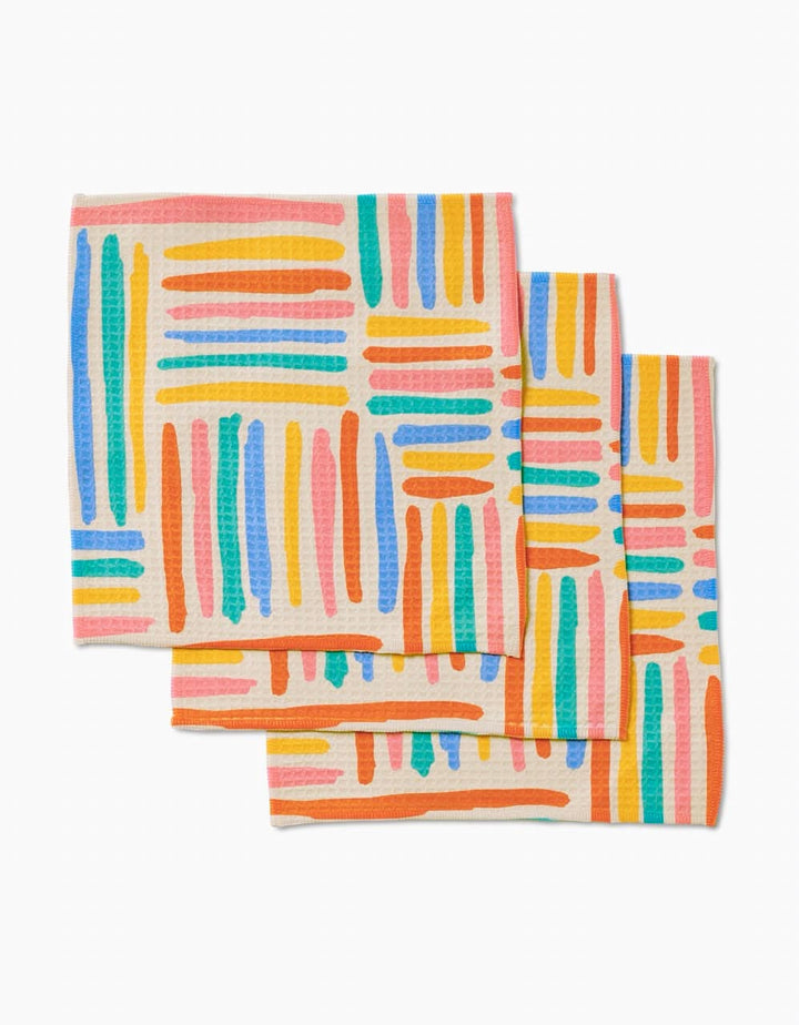 Three Sareka Unique Pathways Luxe Washcloths feature a vibrant abstract pattern of orange, blue, green, pink, and yellow lines on a light background, crafted with ultra-absorbent Geoweave technology.