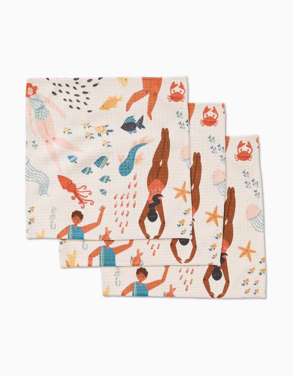 Add a fun touch to your routine with Spirit of the Ocean washcloths by Janna Sue Design—three ultra-absorbent cloths featuring playful illustrations of swimmers, mermaids, and cheerful sea creatures in bright colors.