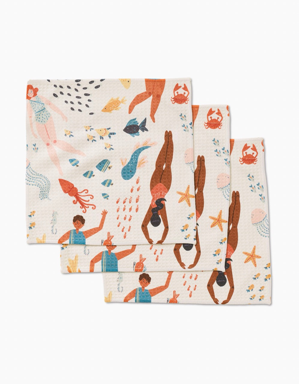 Add a fun touch to your routine with Spirit of the Ocean washcloths by Janna Sue Design—three ultra-absorbent cloths featuring playful illustrations of swimmers, mermaids, and cheerful sea creatures in bright colors.
