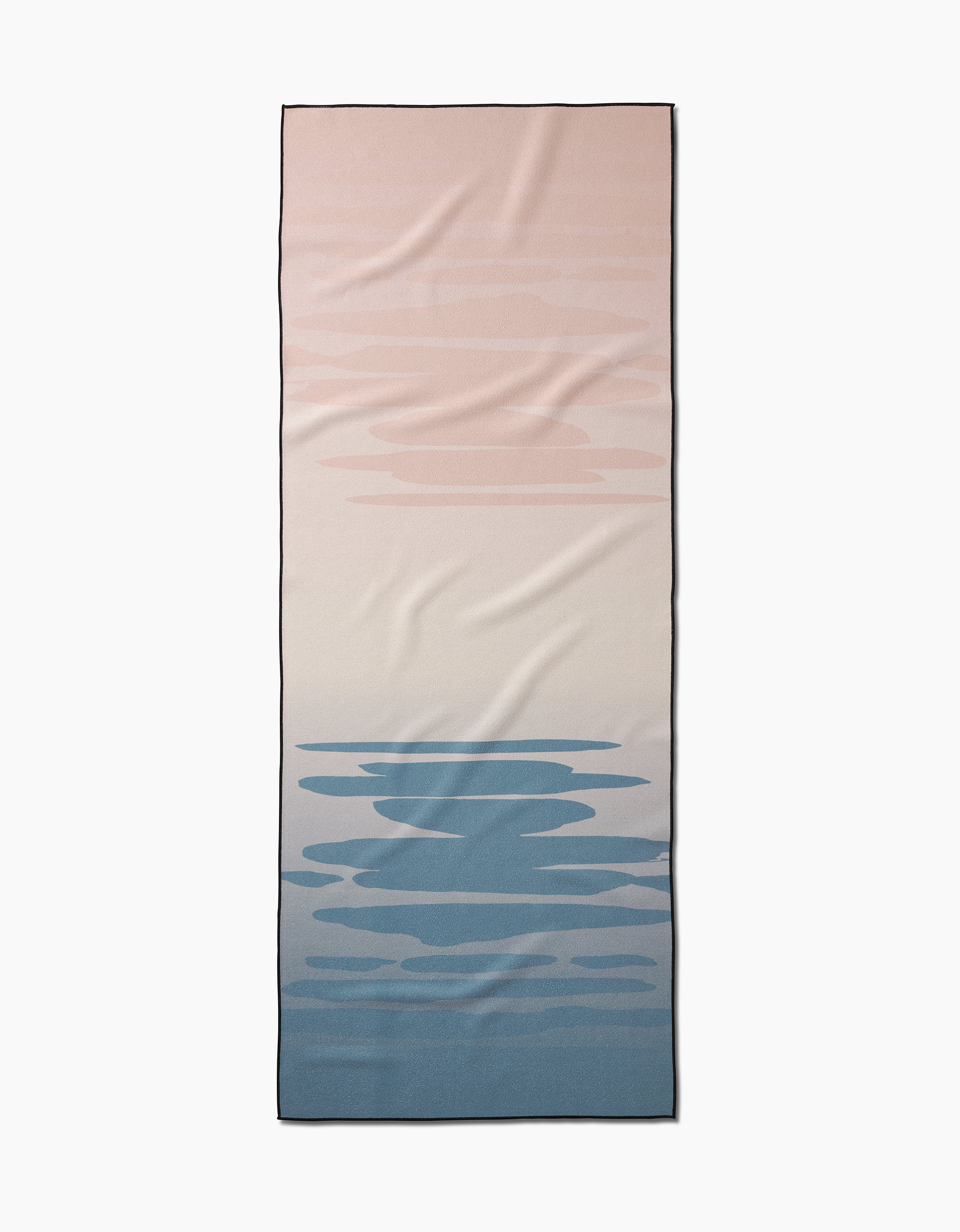 The GEOMETRY Balance yoga towel is rectangular and slip-resistant, featuring a gradient from soft pink to cream and blue with abstract cloud or ripple motifs.