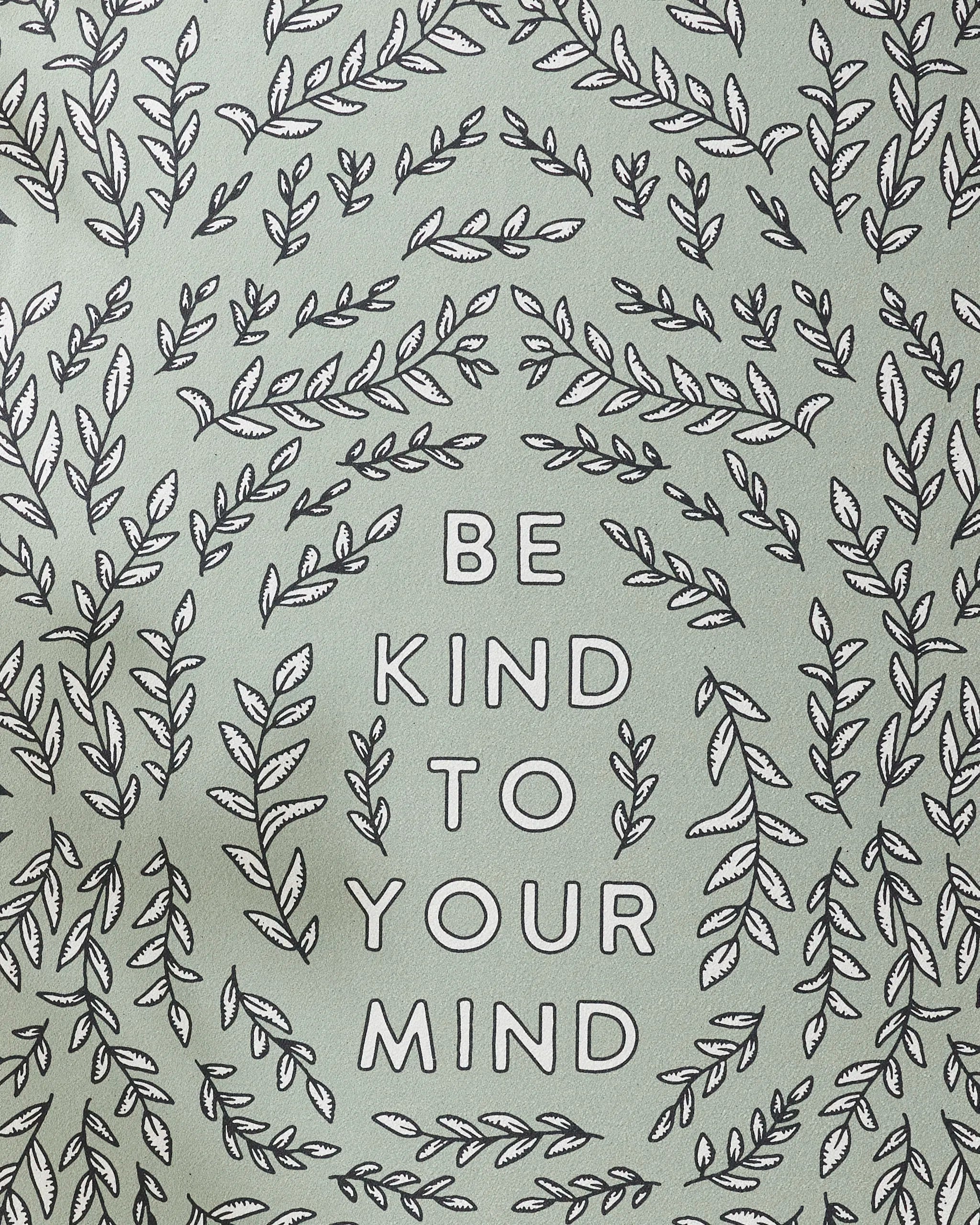 The image features BE KIND TO YOUR MIND in bold uppercase, framed by leafy branches on a light green background—perfect inspiration for your next yoga session with the Graphics and Grain Be Kind To Your Mind non-slip towel.