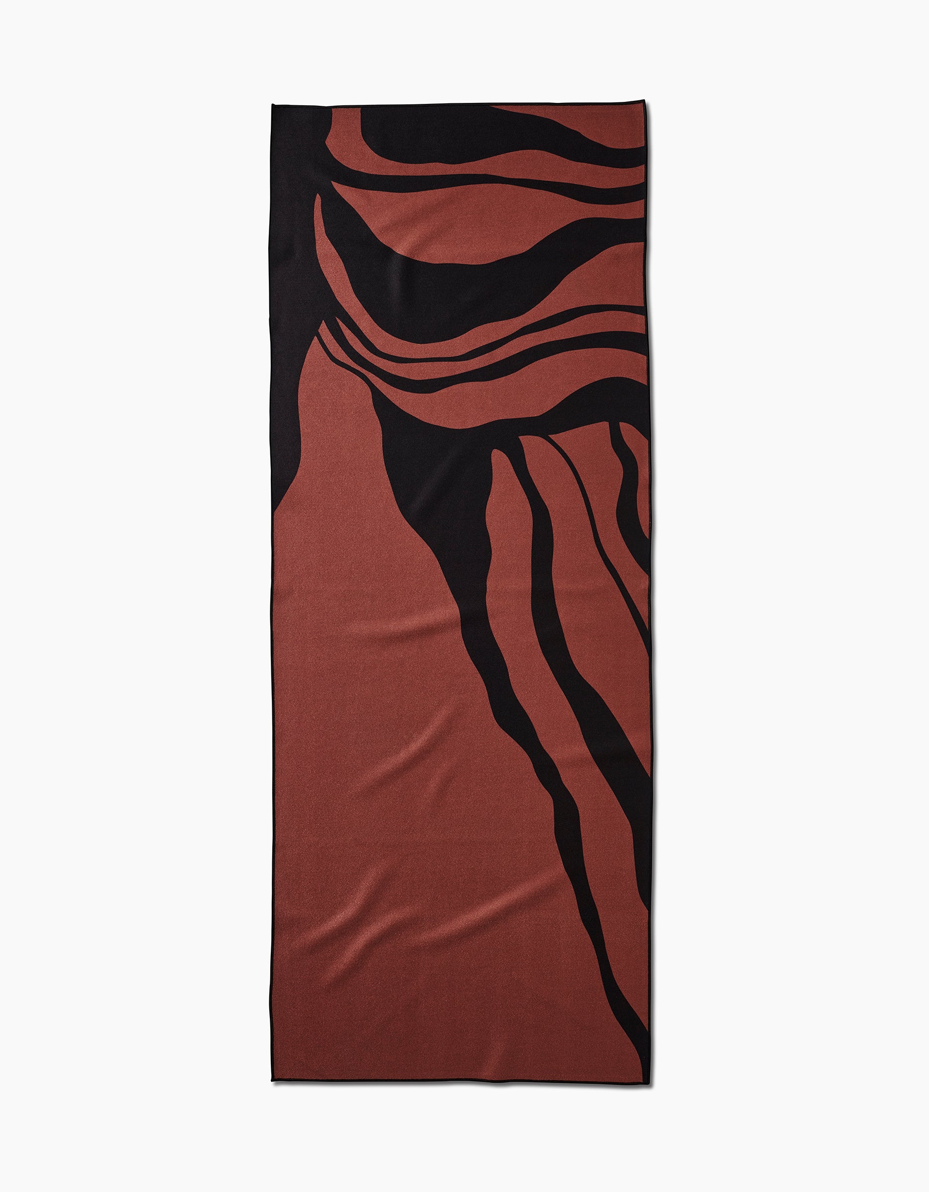 The Cole Strem Black Swirl yoga towel features bold black abstract lines and organic shapes on a rectangular brown surface. Made from recycled materials, its shown flat against a white background for a modern, eco-friendly look.
