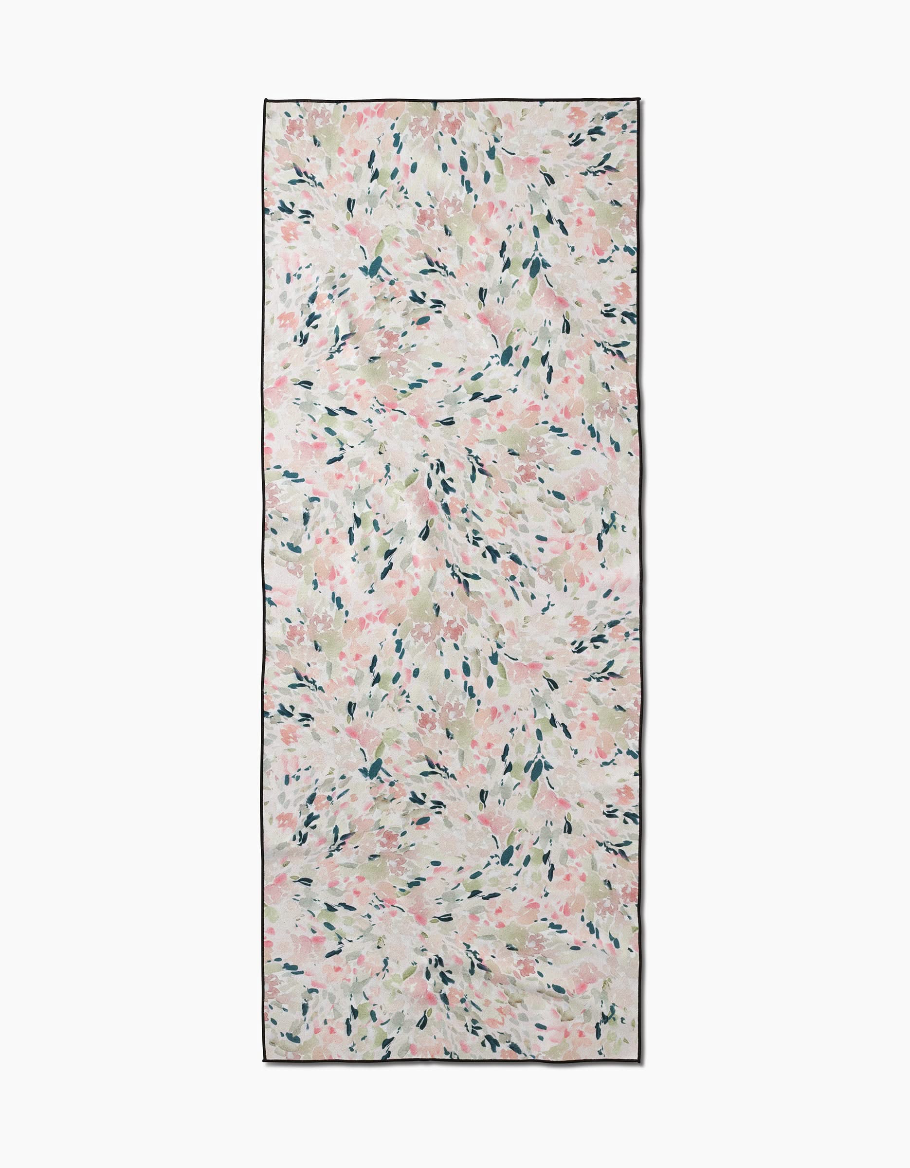 Blossoms by Anee Shah: a rectangular scarf with a light pastel abstract floral print in green, pink, and peach on cream, bordered by a dark outline. Crafted from recycled materials for an eco-friendly touch.