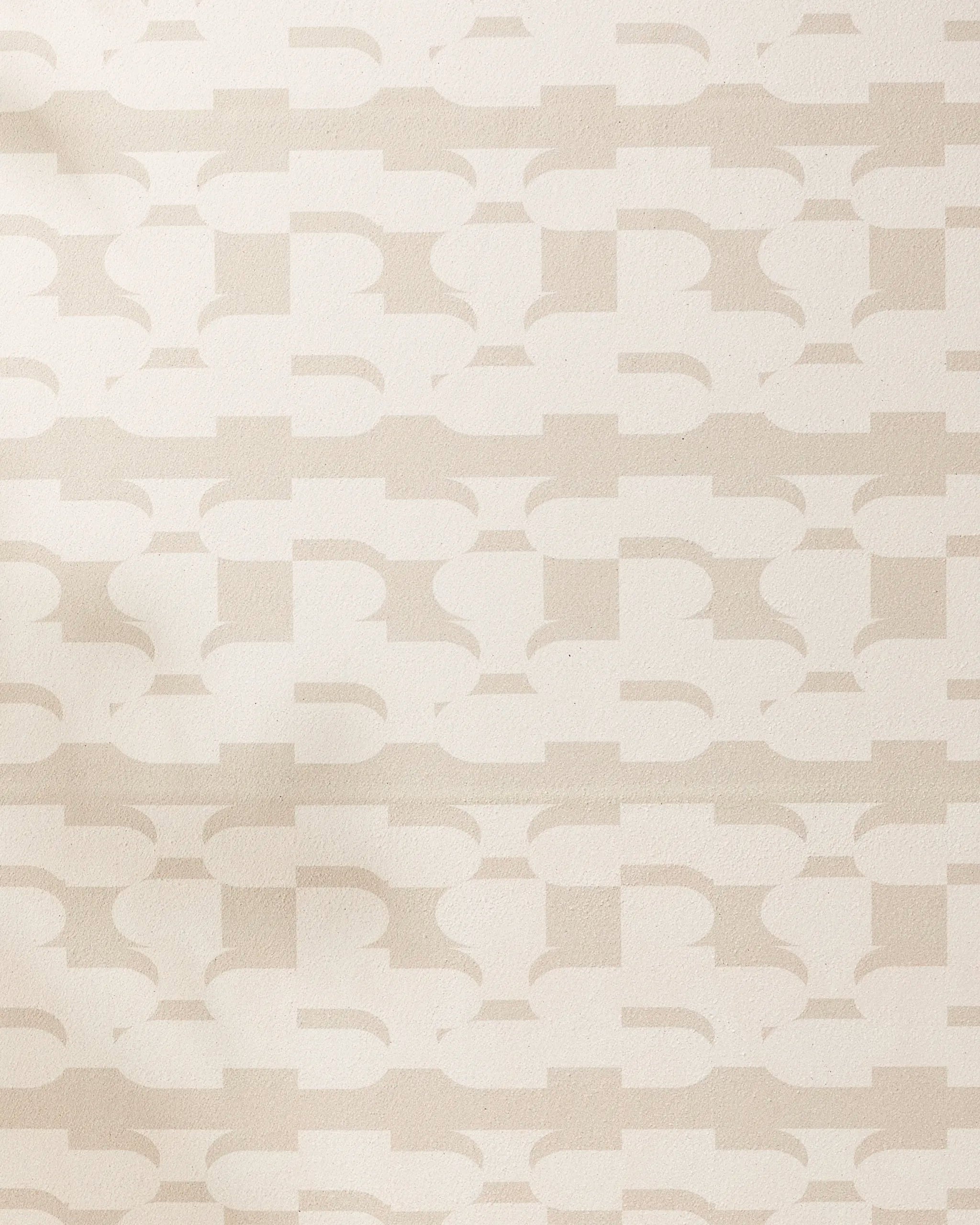 The Geometry Buttons yoga towel features a beige and cream geometric pattern with interlocking shapes on a textured, non-slip surface for a subtle, abstract, and modern look.