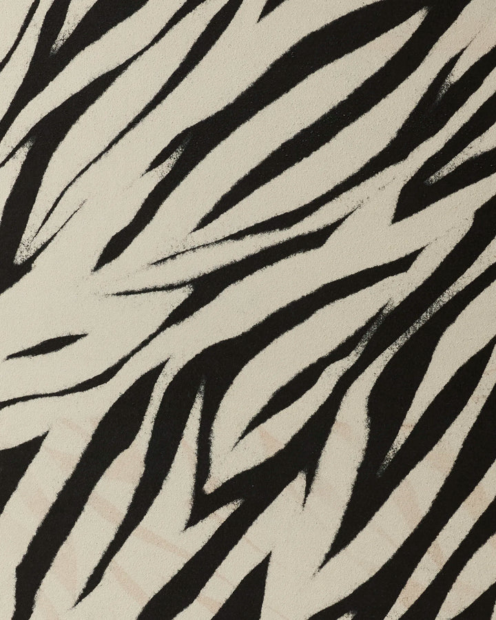 Close-up of Chase by GEOMETRY, showcasing an irregular black zebra stripe pattern on a cream background—ideal for adding flair to your non-slip yoga towel.