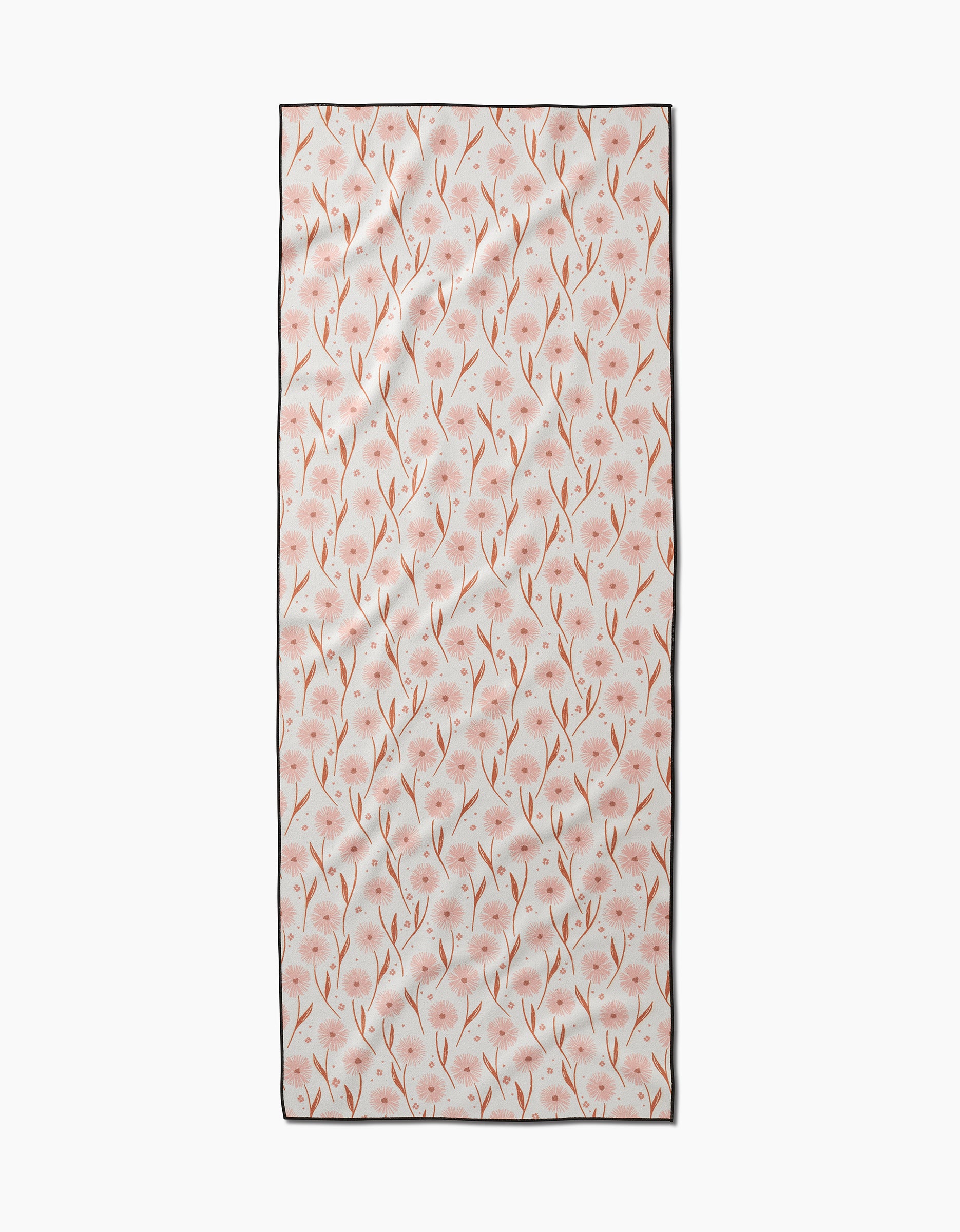 The Daisy Pop yoga towel by Hufton Studio is a rectangular, slip-resistant towel with delicate pink flowers and brown stems on a light background.