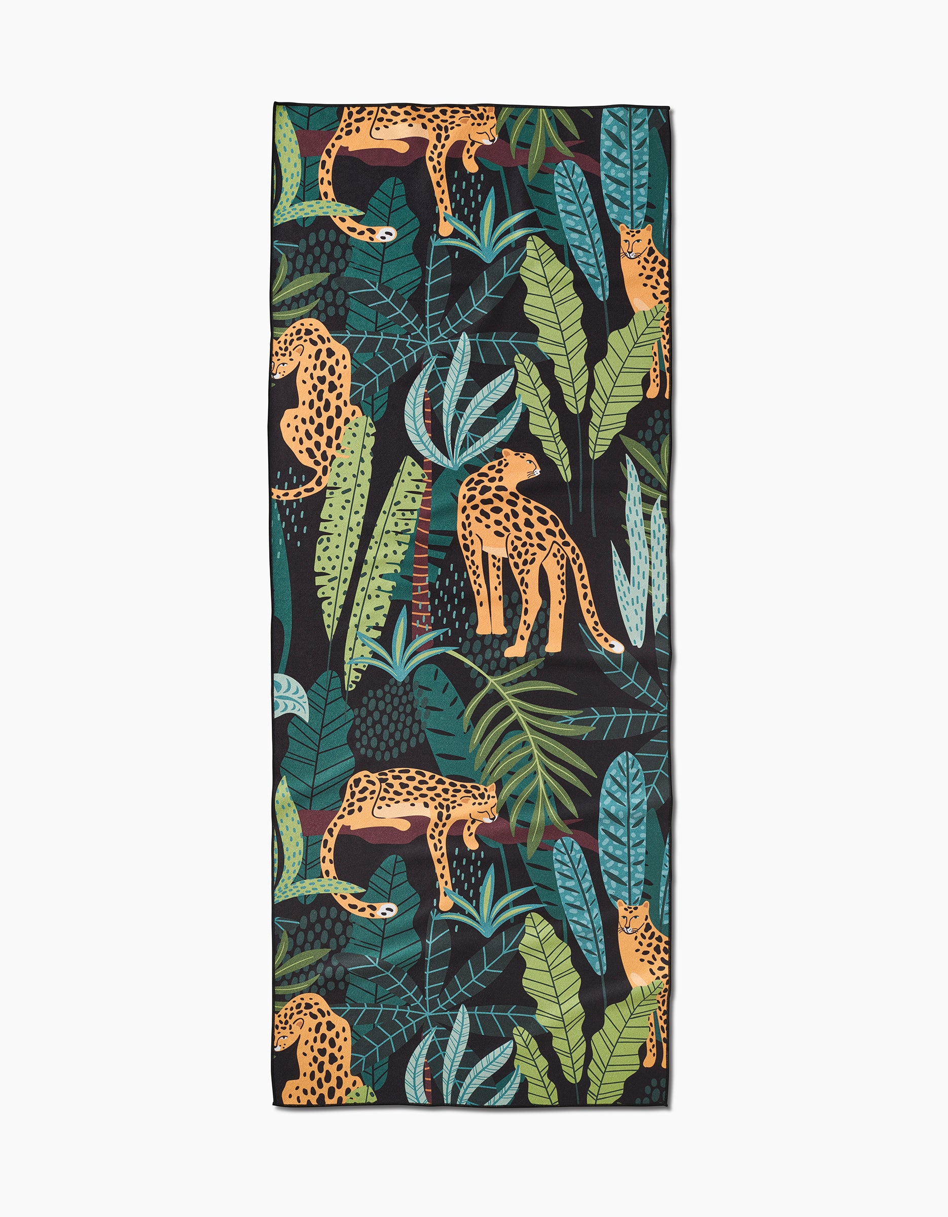The GEOMETRY Feeling Spotty yoga towel features a vibrant pattern of leopards and tropical leaves in green, blue, and teal on black, made from recycled materials.