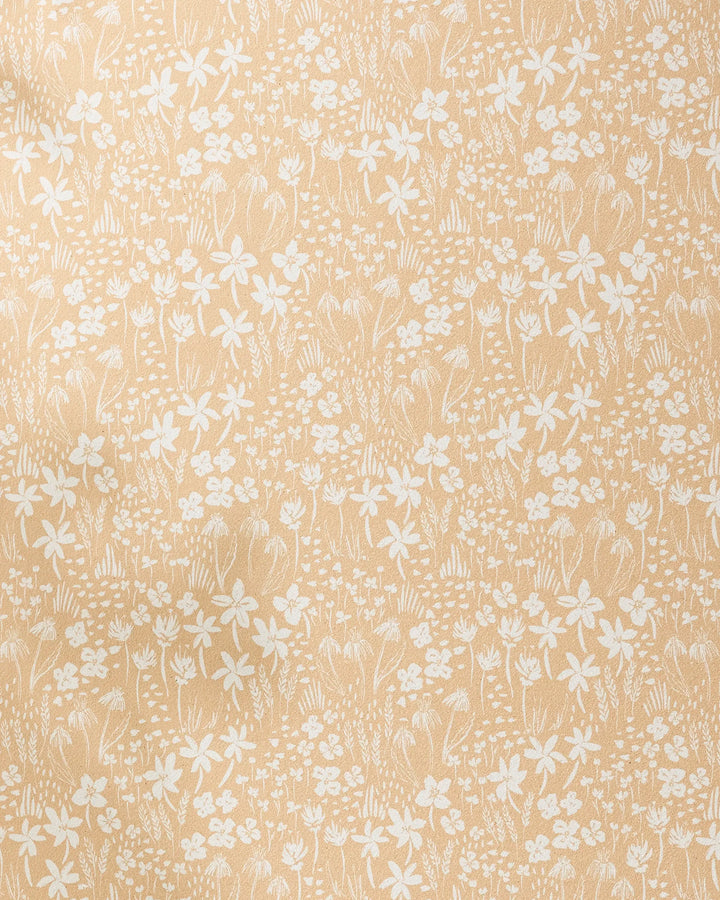 Floating Meadow by Hufton Studio features a beige background with delicate white floral patterns—small flowers, leaves, and stems—which create a vintage-inspired look. This non-slip yoga towel blends style and function for your practice.