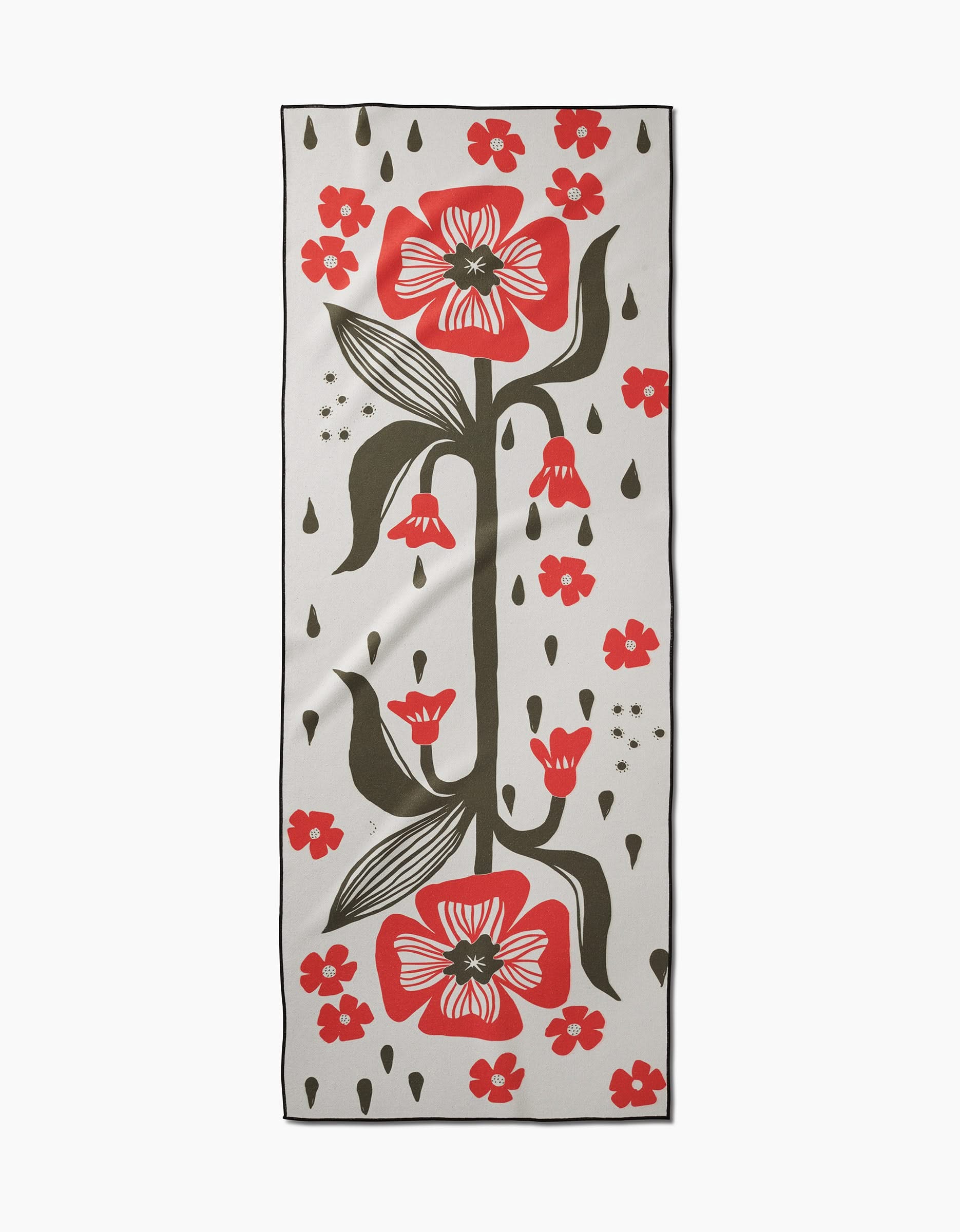 The Flora Stamp scarf by Ash Cascade features a white base with large red flowers, small red blossoms, green leaves, and black-green accents in a symmetrical pattern—crafted from recycled materials.