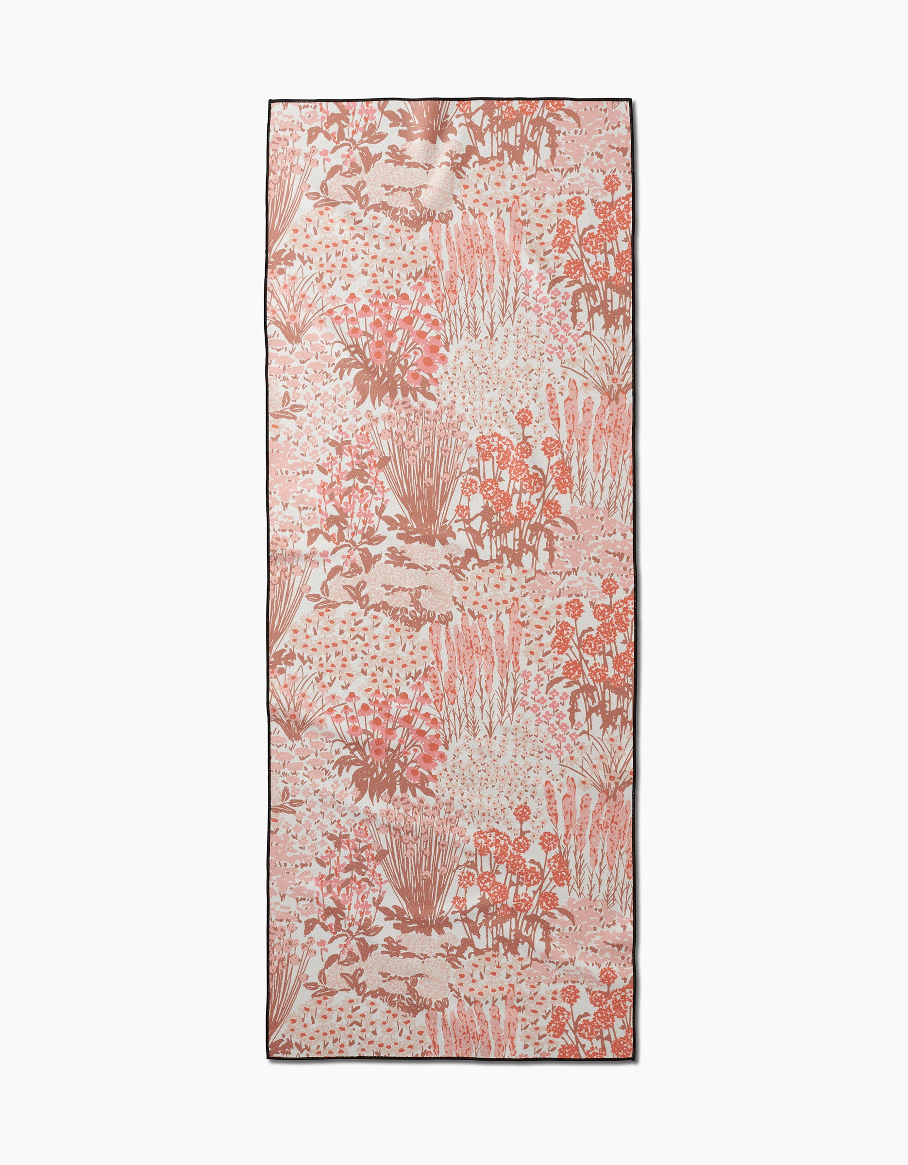 The Garden Bloom yoga towel by Hufton Studio is a rectangular pink and cream towel with a botanical pattern in pink, coral, and beige tones, crafted from recycled materials.
