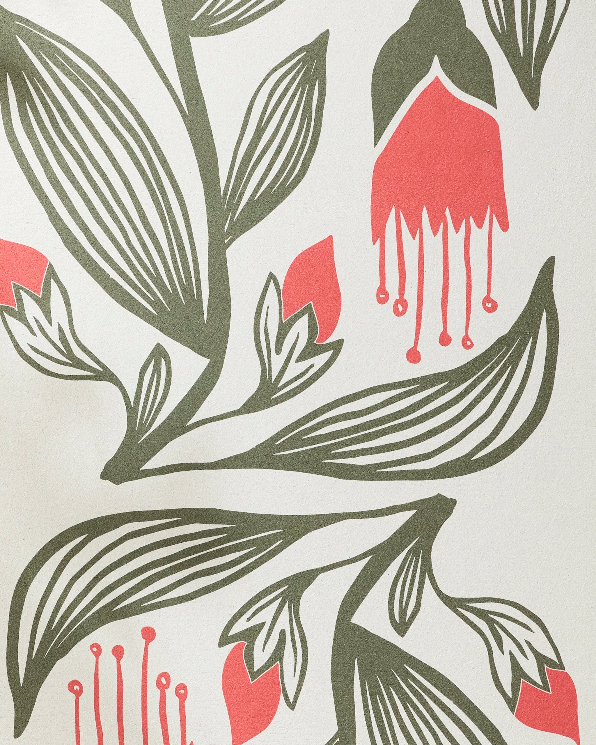 The Garden Stamp yoga towel by Ash Cascade features a modern, abstract design of green leaves and red, bell-shaped flowers with bold lines on a light recycled fabric.