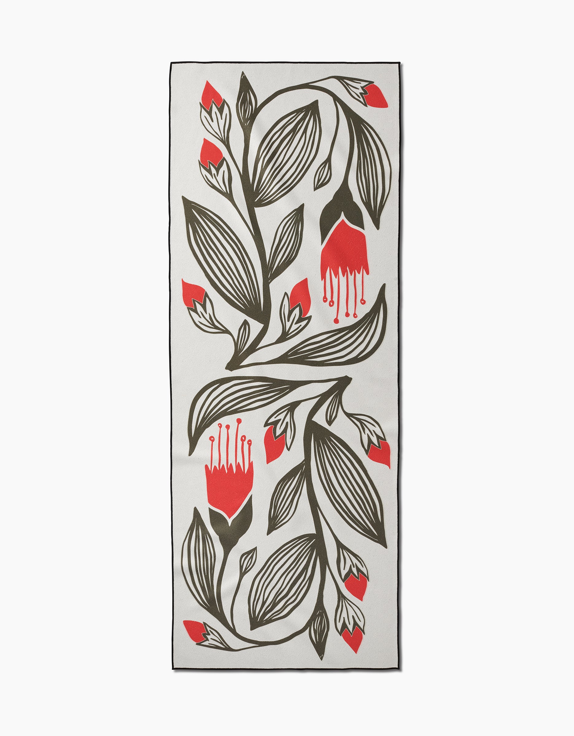 The Garden Stamp yoga towel by Ash Cascade features a modern graphic design with bold black leaves and red flower blossoms on white, crafted from recycled materials.
