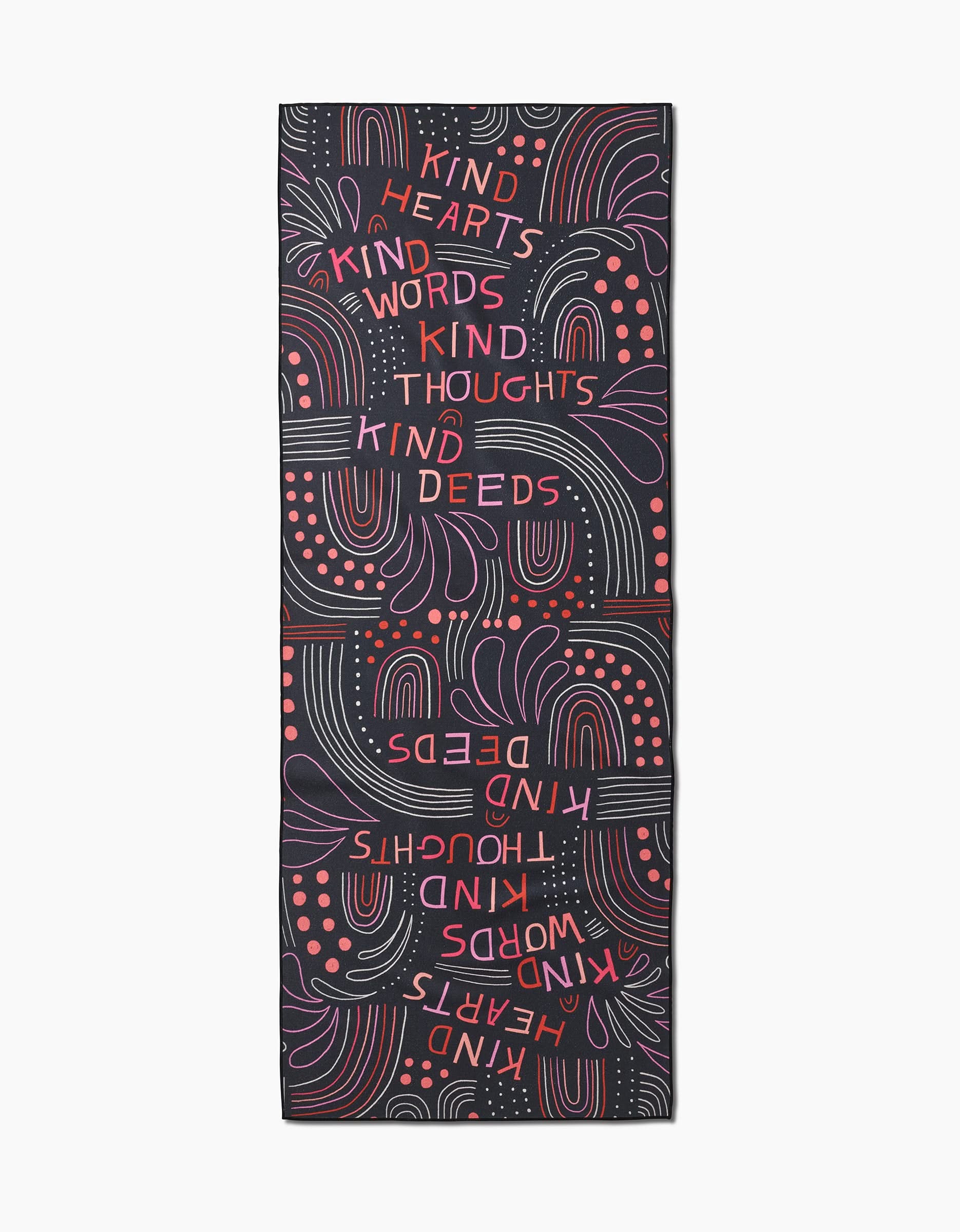 The Kind Hearts yoga mat by Jessica Swift features a black base with red and purple abstract patterns and “Kind hearts, kind words, kind thoughts, kind deeds” repeated both ways—ideal to pair with your recycled yoga towel.