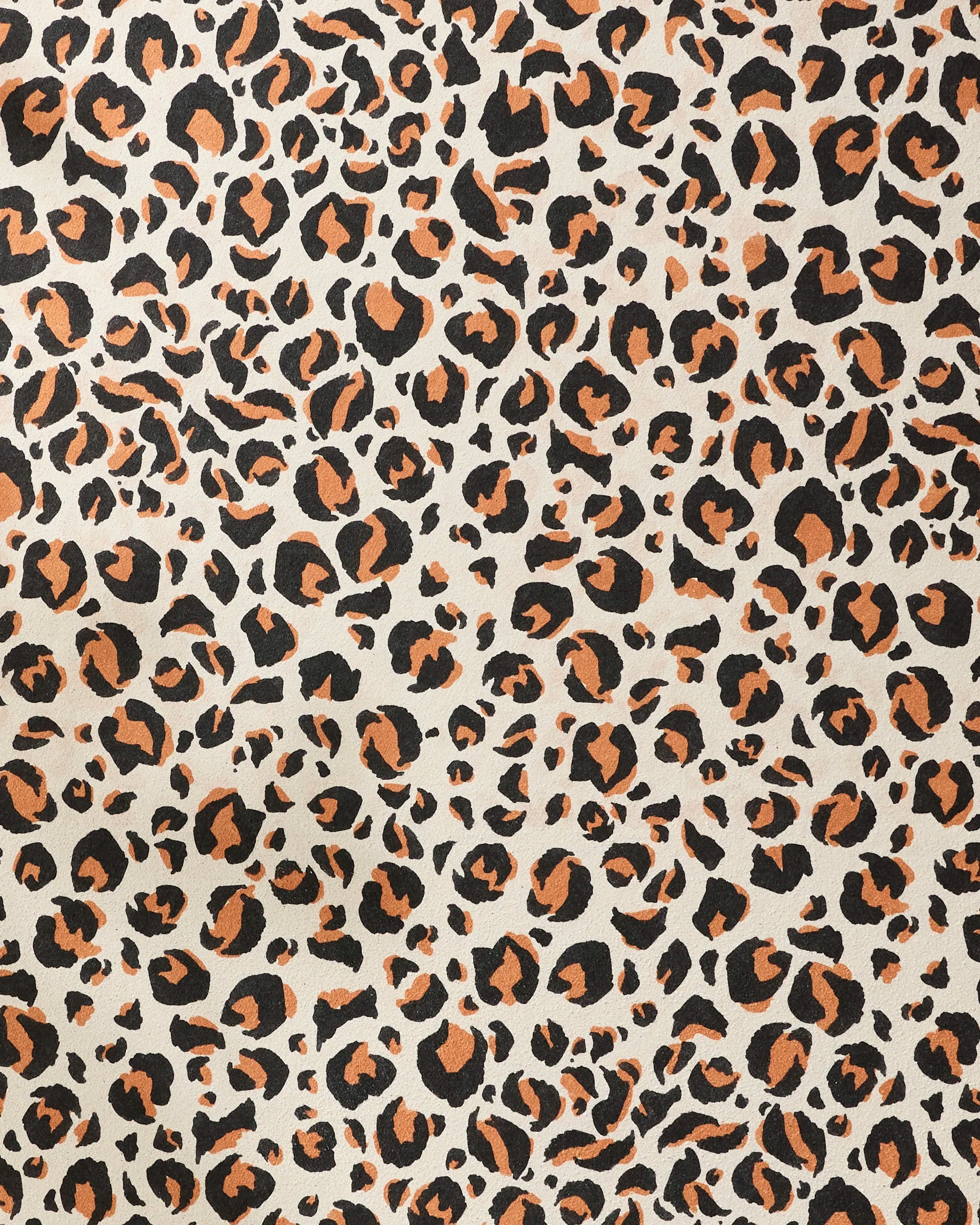 The GEOMETRY Leopard yoga towel features an irregular black and orange leopard print on beige, adding wild style and non-slip comfort to your practice.