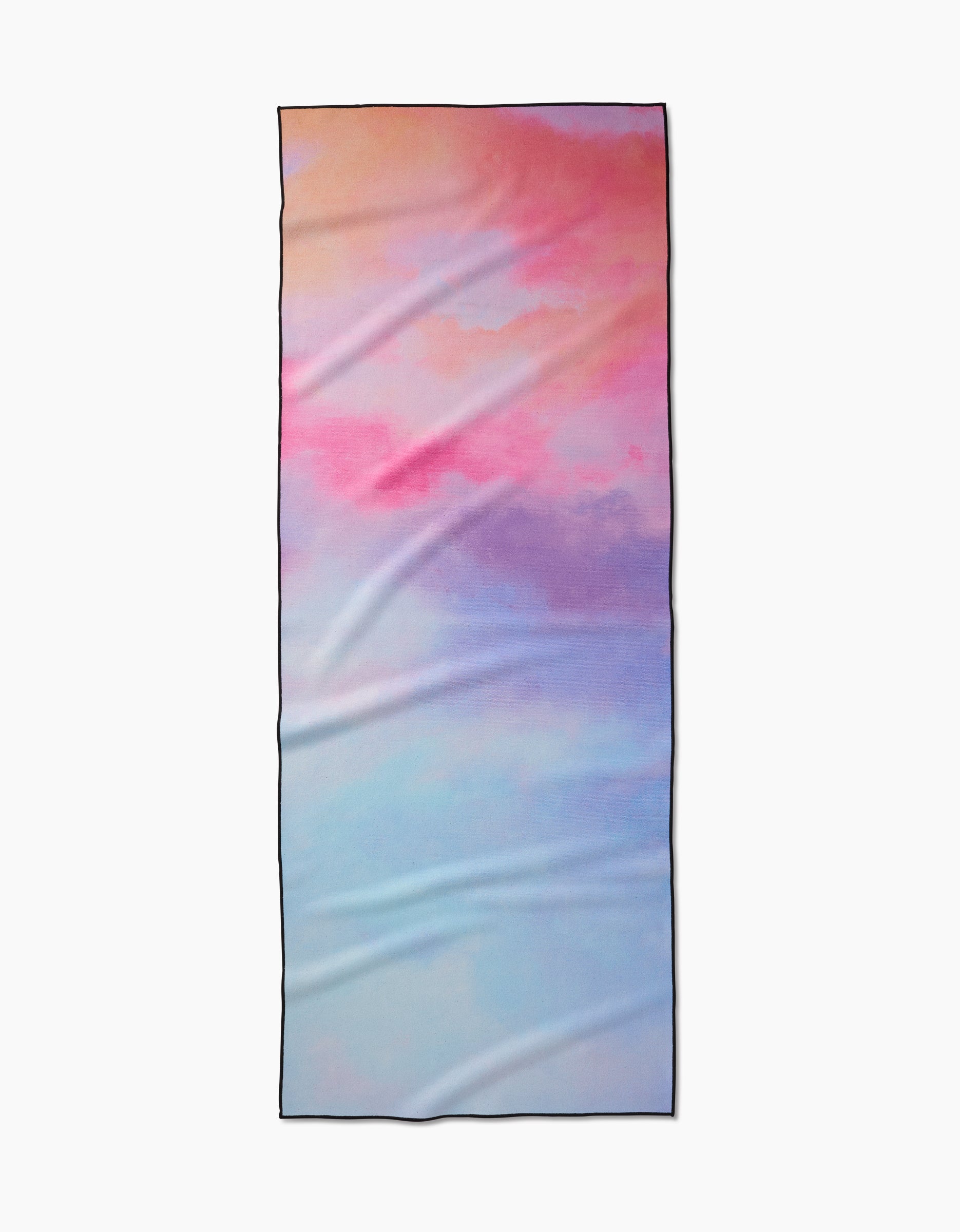 The Magic in the Sky yoga towel by Stefanie Bales features a soft pastel gradient in pink, peach, purple, and blue tones. Made from recycled materials, this rectangular towel is shown flat with some visible creases.