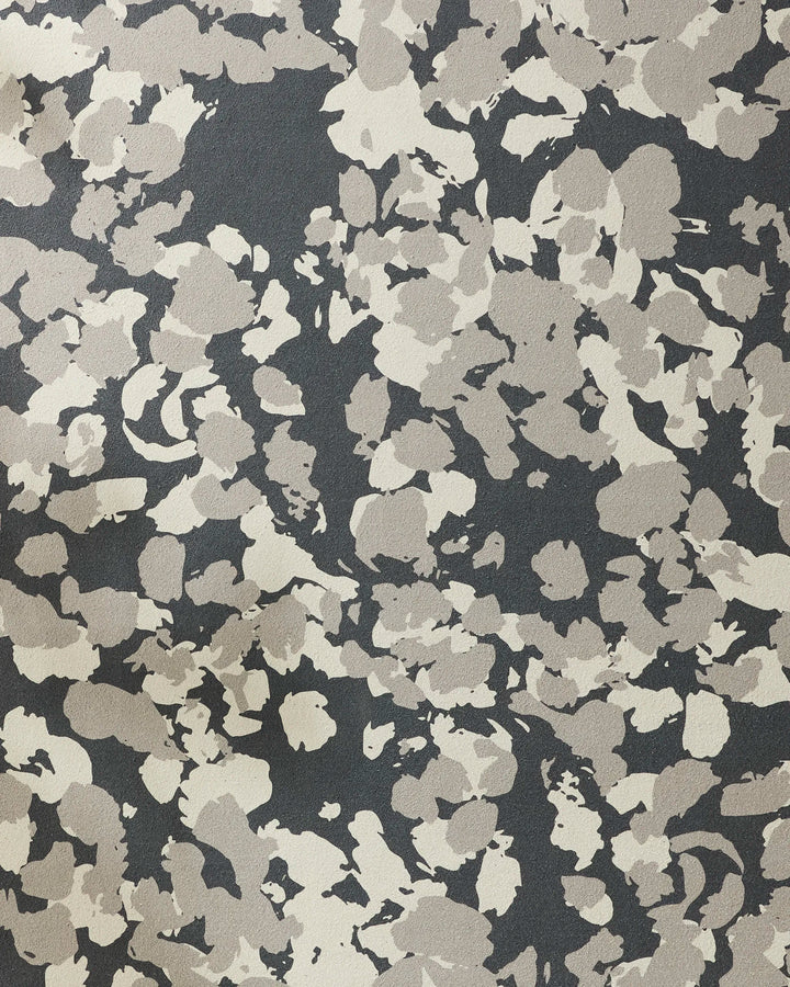 A close-up of Metro Mesh by GEOMETRY, showcasing an abstract camouflage pattern with irregular beige, gray, and black blotches on a non-slip yoga towel—perfect for adding textured style to your practice.