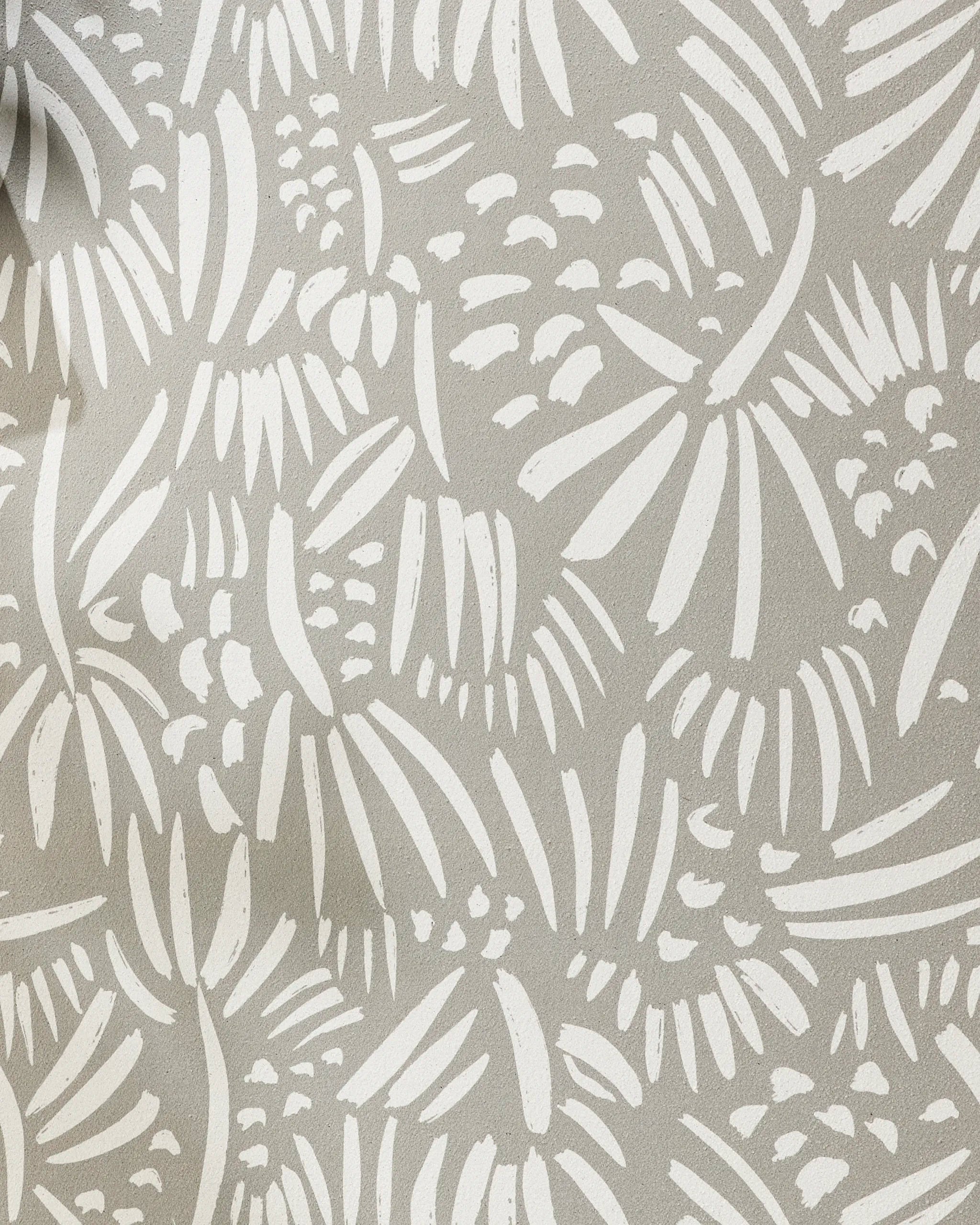 The Miami yoga towel by Hufton Studio features an abstract pattern of white brushstrokes on light gray, evoking scattered leaves or petals—adding texture and style to this recycled, non-slip yoga towel.