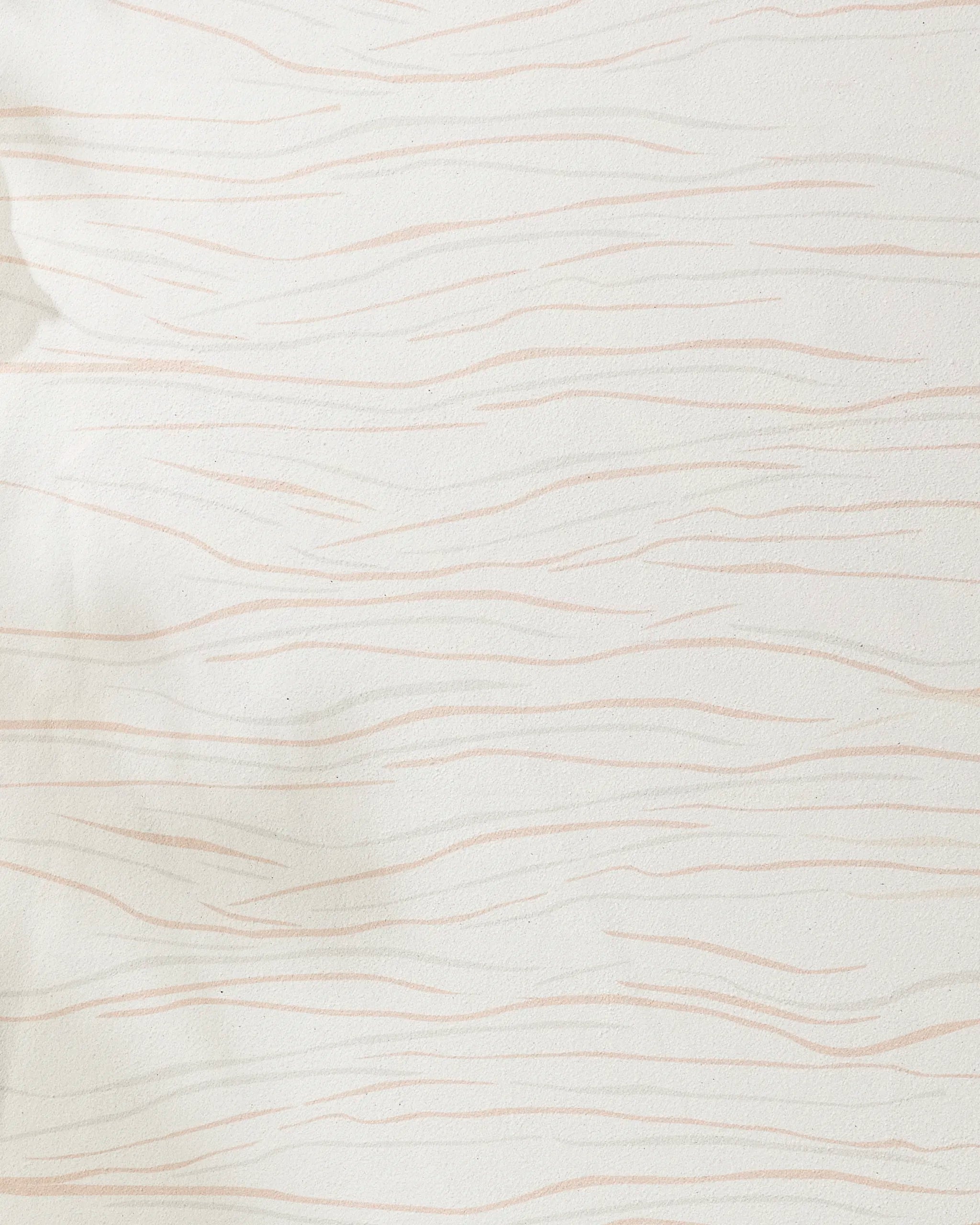 The GEOMETRY Mind yoga towel is cream-colored with thin, wavy light pink lines in a subtle abstract pattern. Made from recycled materials, its soft texture appears gently wrinkled in some spots.