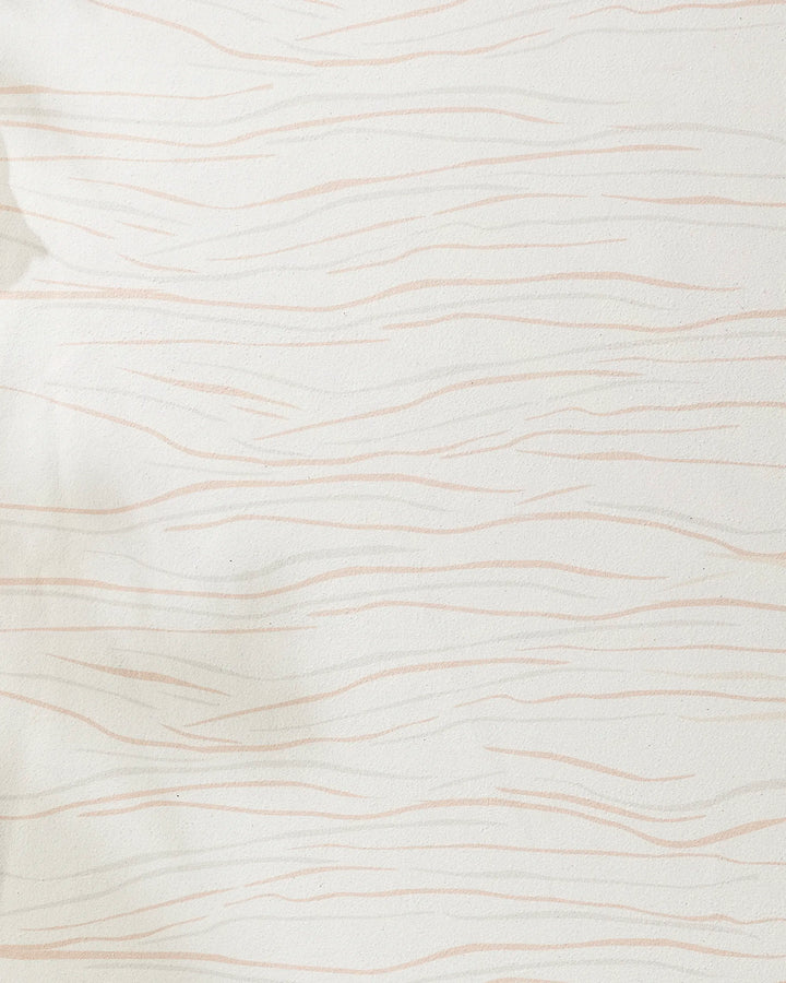 The GEOMETRY Mind yoga towel is cream-colored with thin, wavy light pink lines in a subtle abstract pattern. Made from recycled materials, its soft texture appears gently wrinkled in some spots.
