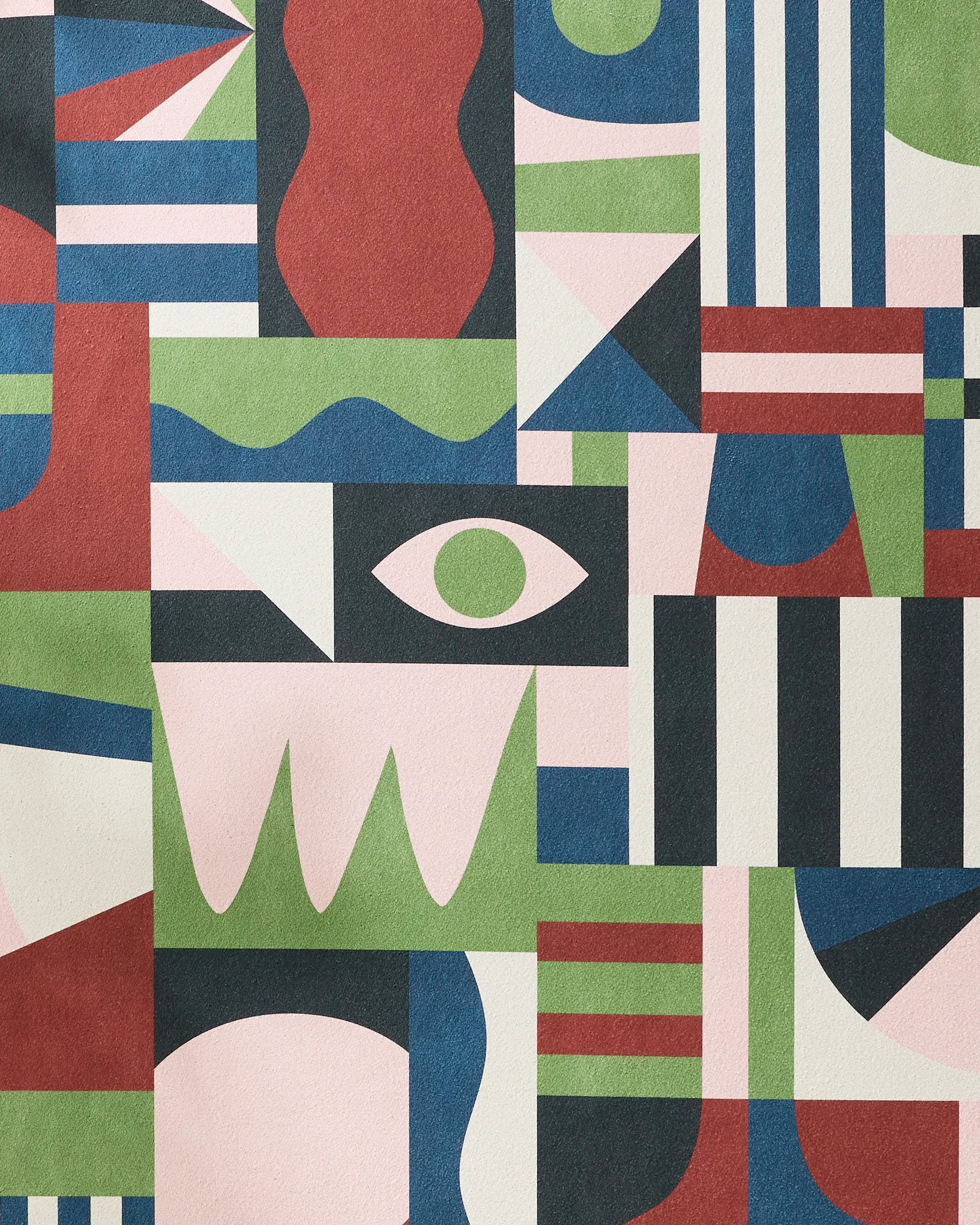 Modern Bauhaus Mood by Claire Iglesias features abstract geometric artwork with stripes, triangles, waves, a central eye, and bold forms in pink, green, red, blue, black, and white—evoking the innovative style of a recycled yoga towel.