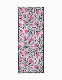 The Petal Symphony yoga towel by Anette Heiberg features an abstract, modern pattern of pink flowers with dark stems on a light background, framed by black borders. This rectangular towel is non-slip and perfect for stylish practice.
