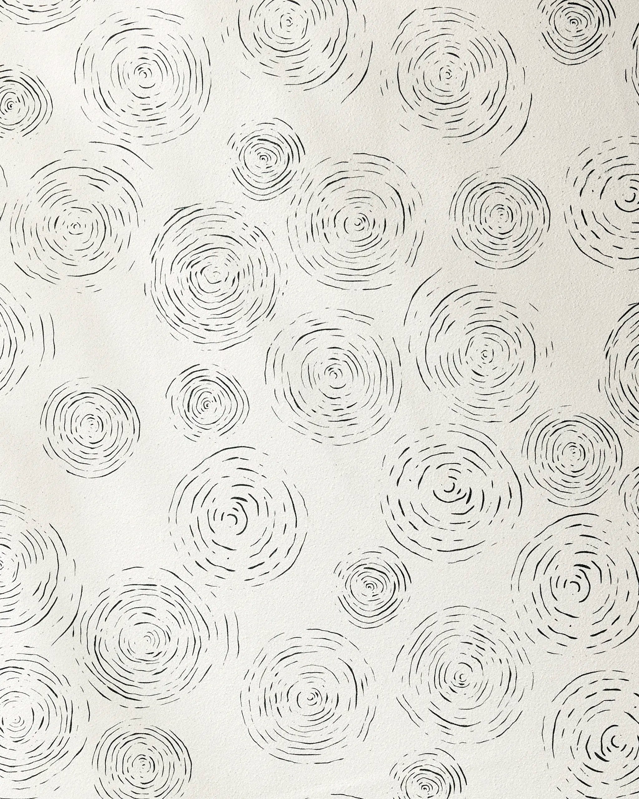 Rhythmic by GEOMETRY features hand-drawn black concentric circles on white, evoking abstract tree rings. This minimal, repeating pattern is ideal for a yoga towel with silicone grip made from recycled materials.