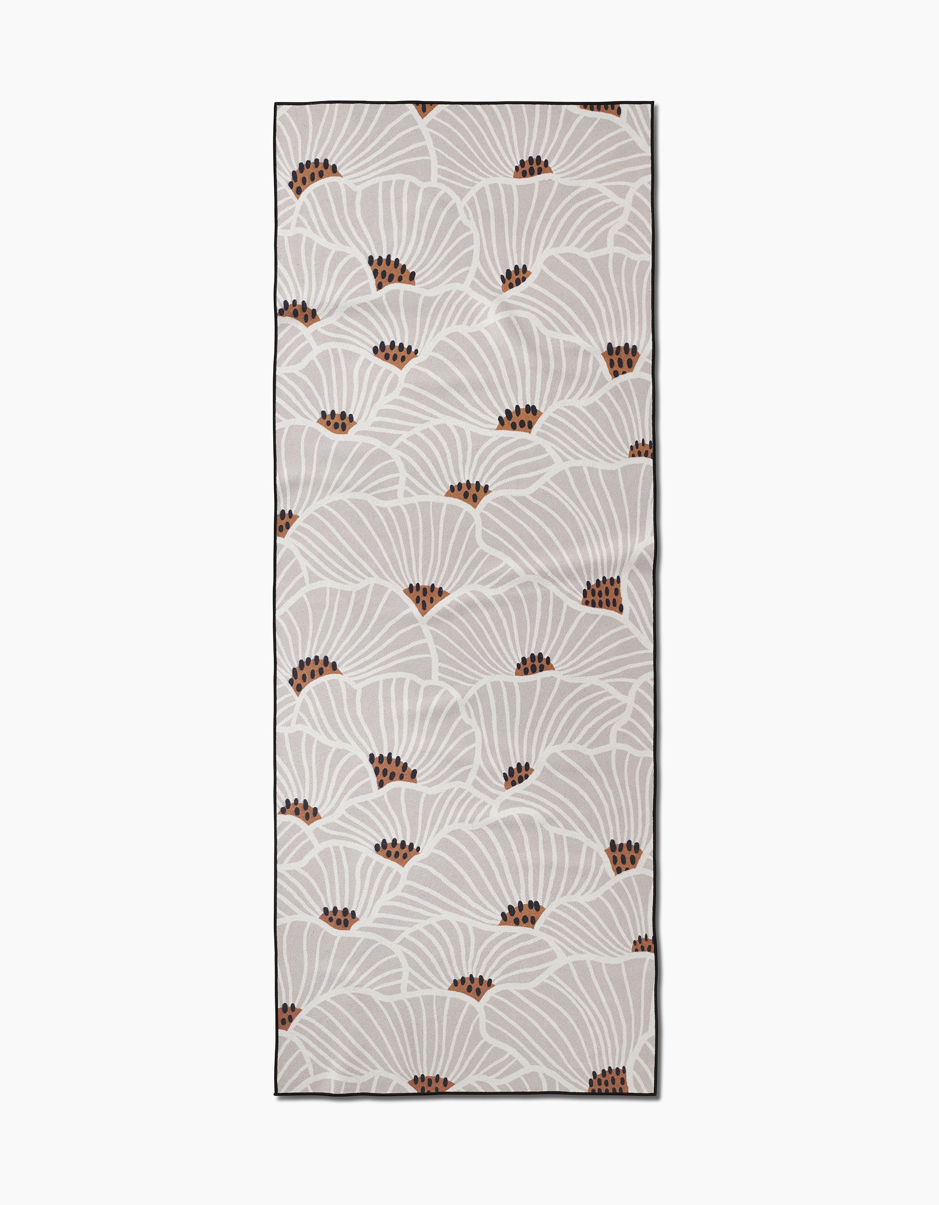 The San Diego yoga towel by Amy MacCready is rectangular and beige, featuring white fan-shaped leaves with brown dots and a dark border. Made from recycled materials for an eco-friendly touch.