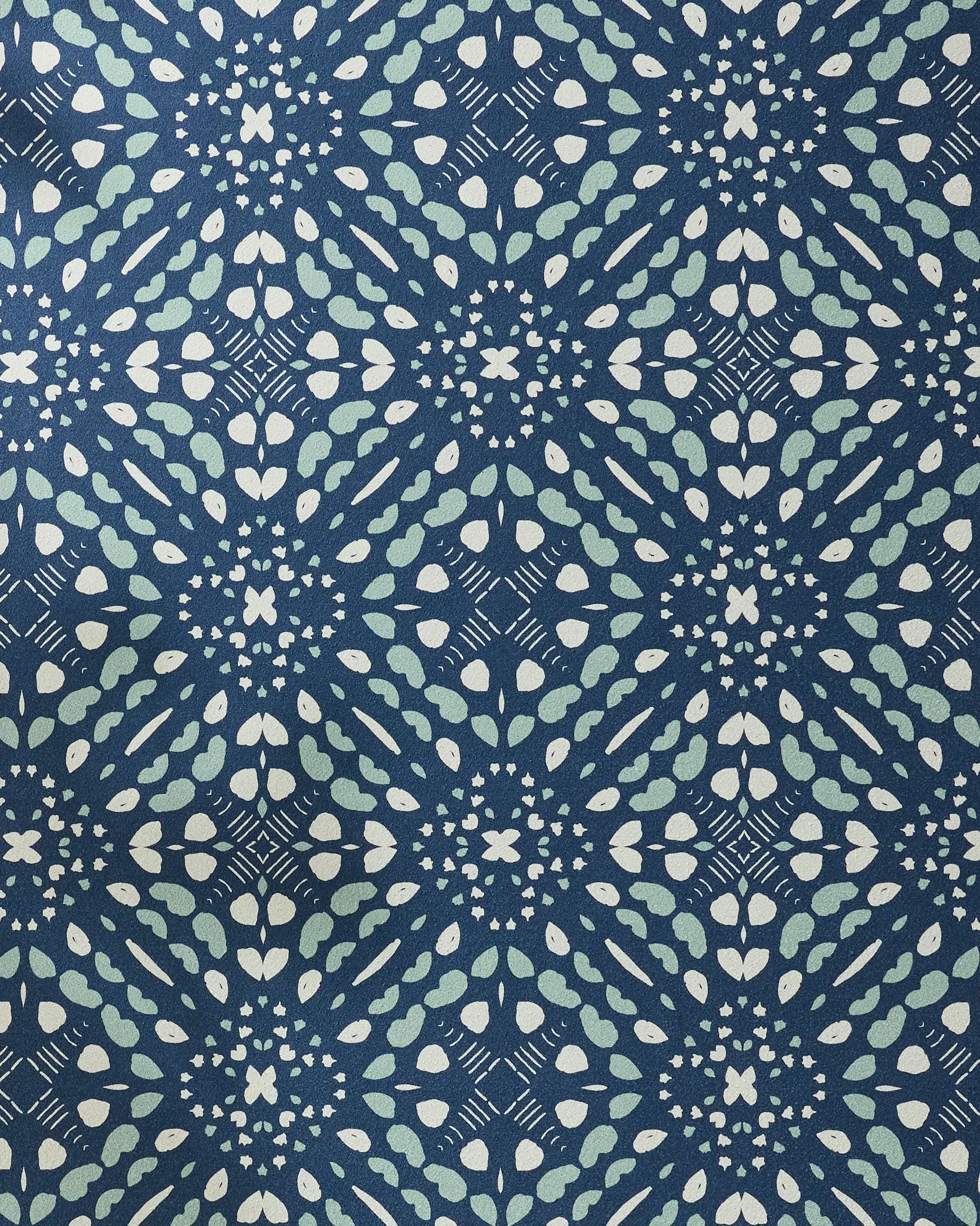 Seeds and Nuts by Twig + Spark: A blue and white geometric fabric with repeating diamond shapes and curved lines, creating a textured, symmetrical look—ideal for a stylish non-slip yoga towel.