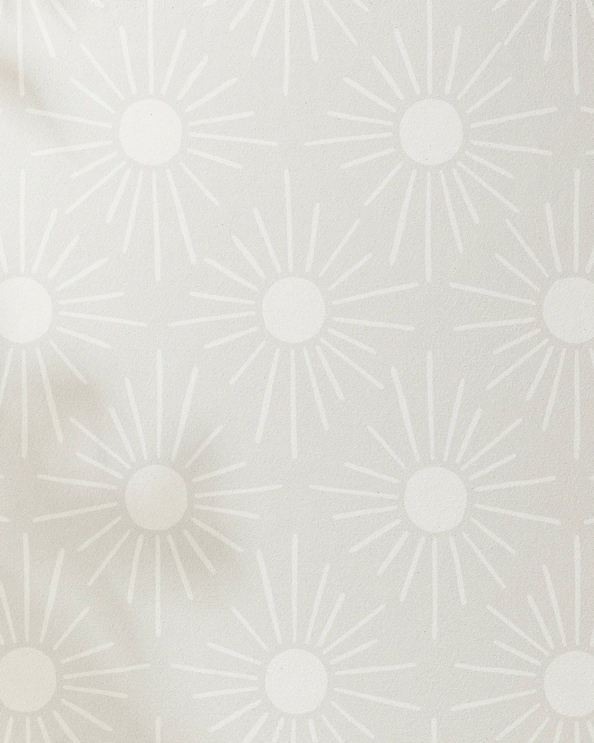 Sunny Geo wallpaper by Hufton Studio features a light grey background with white sunburst shapes—each with a central circle and radiating lines—for a modern, calming effect reminiscent of yoga towel designs.