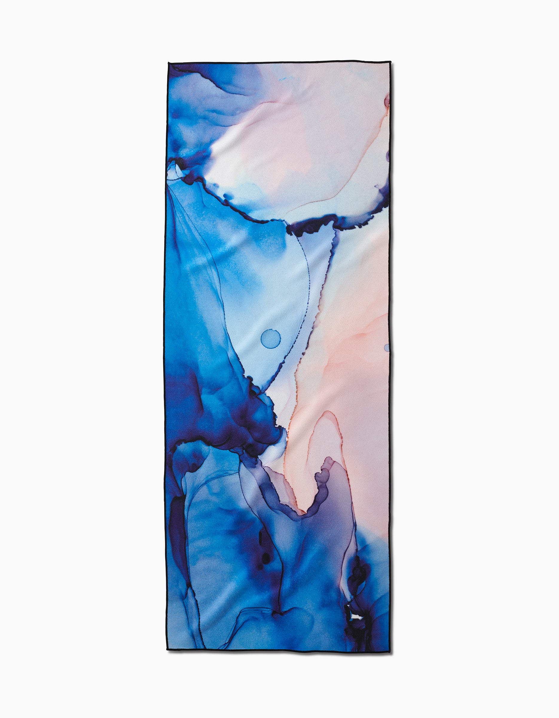 The GEOMETRY “Water And Ink” rectangular scarf is made from recycled materials, showcasing abstract blue, indigo, and soft pink watercolor marbled patterns on a light background.