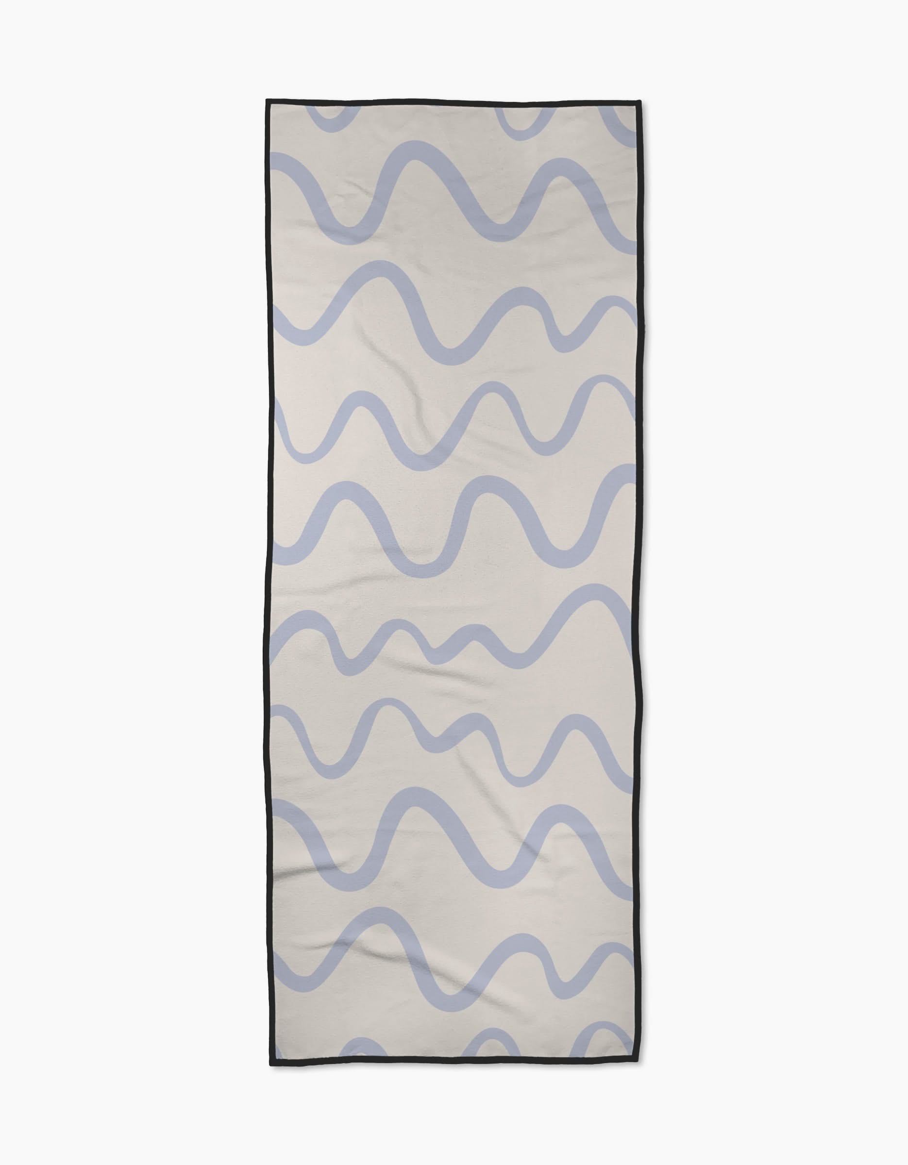 The Wavy Stripe in Blue yoga towel by Teri the Butter is a rectangular, recycled towel featuring wavy blue lines on a light beige background with a thin black border.