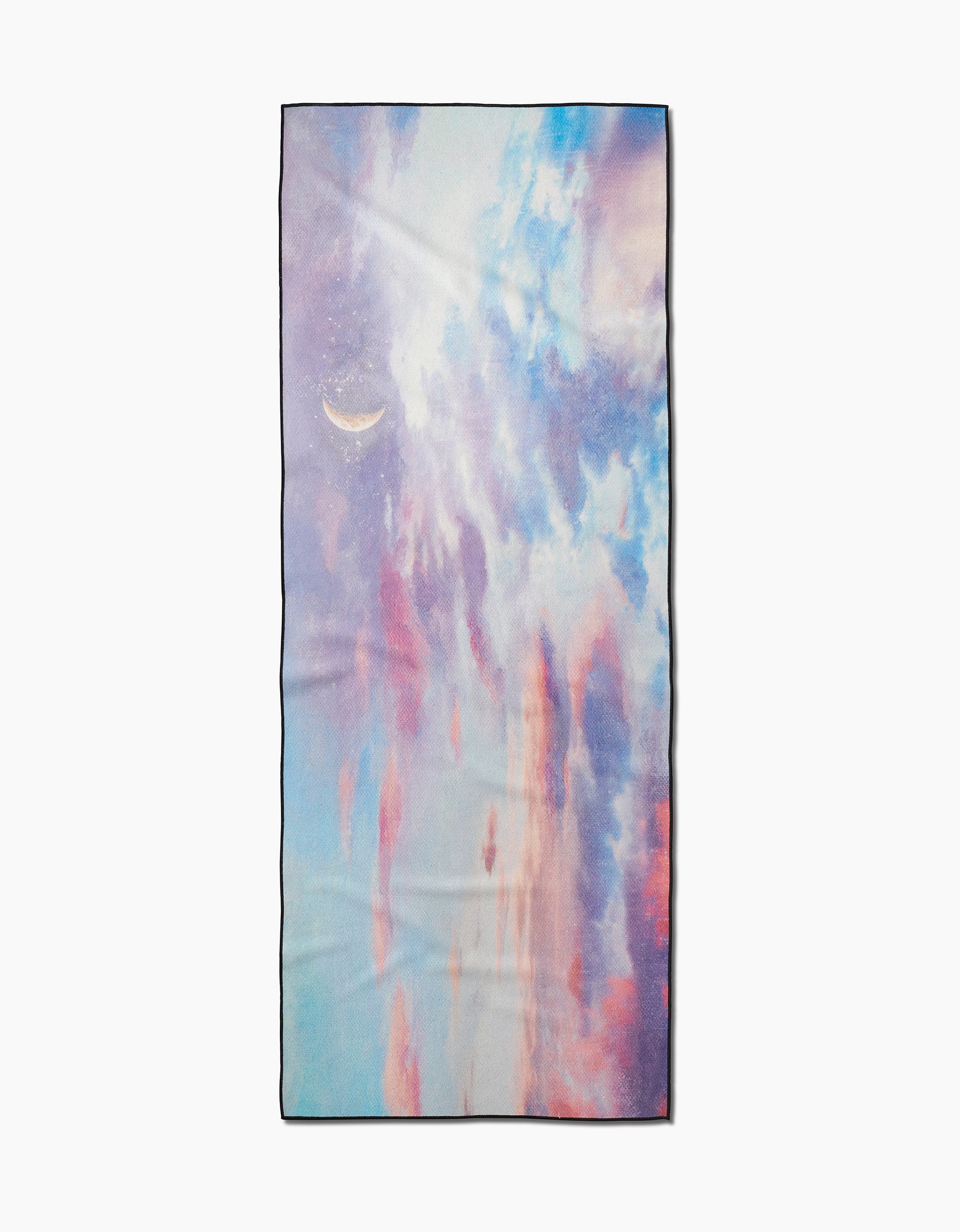 The When I Close My Eyes yoga towel by Stefanie Bales is rectangular, slip-resistant, and showcases soft blue, pink, and purple pastel clouds with a dreamy crescent moon on the top left.