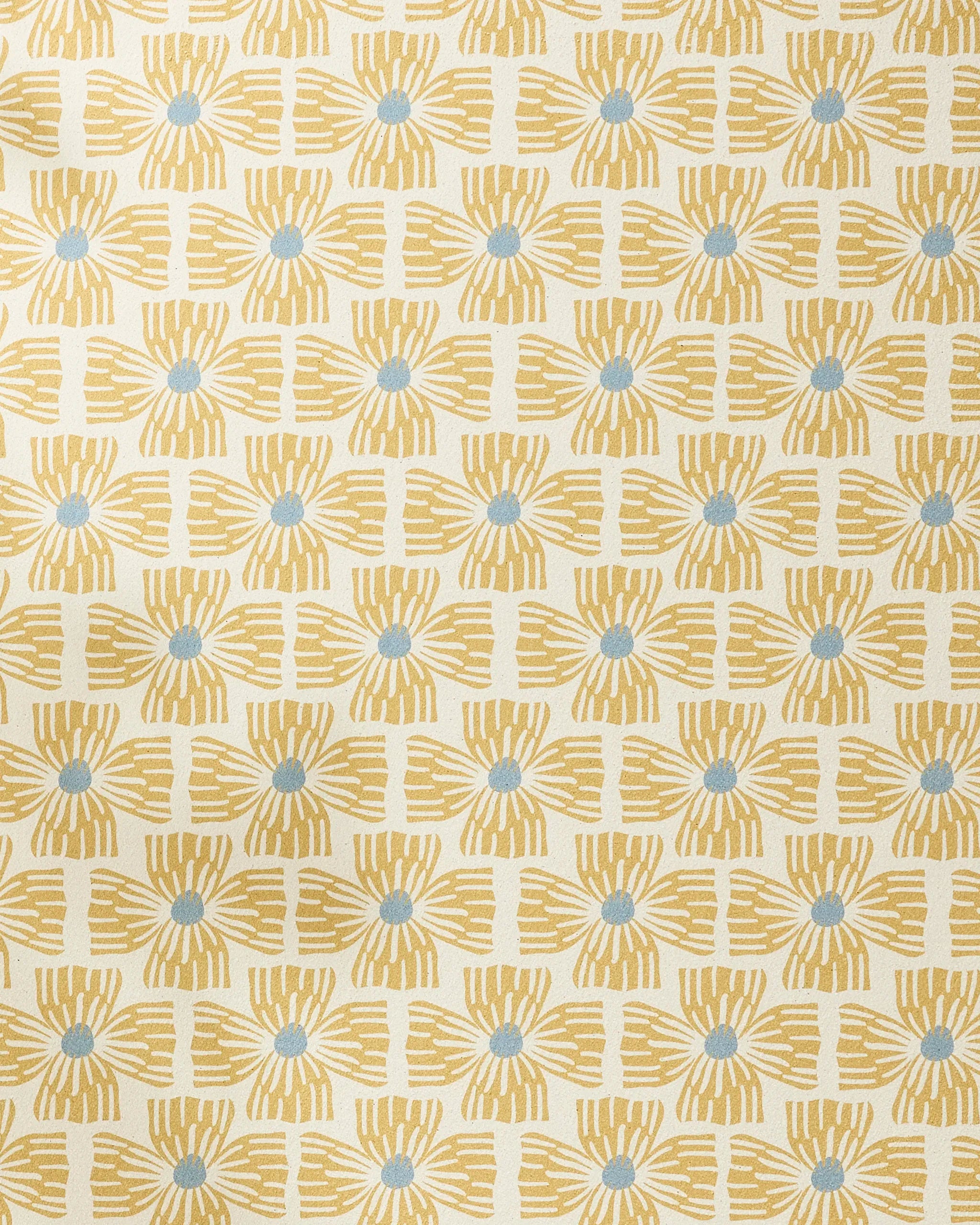 Wildflower by Ash Cascade features a hand-drawn geometric pattern of yellow sunburst shapes with blue centers on cream. This evenly spaced design adds stylish, sustainable flair to any recycled yoga towel.