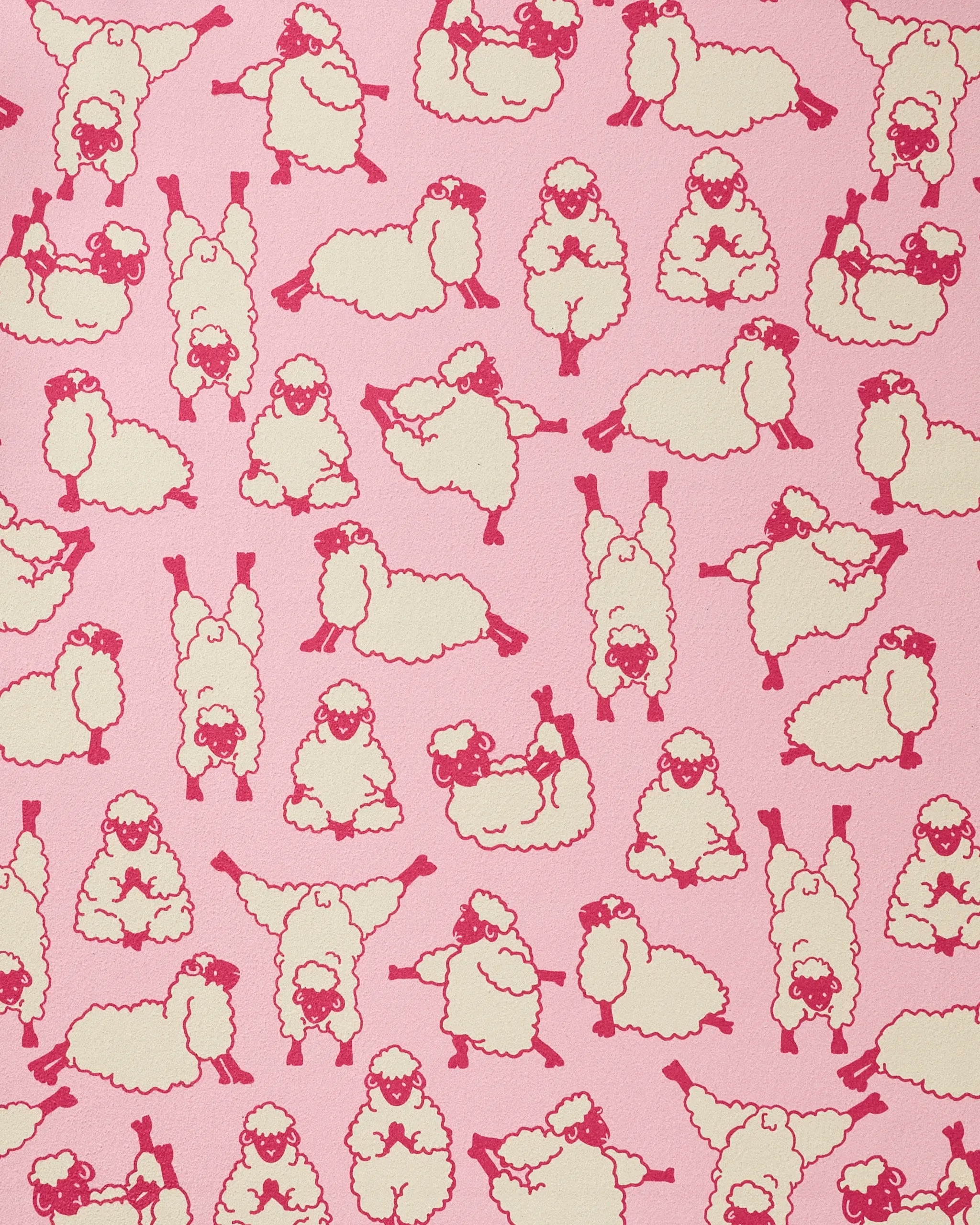 The Geometry Yoga Sheep towel features playful red-outlined cartoon sheep in yoga poses on a pink background, creating a fun and functional recycled yoga accessory.