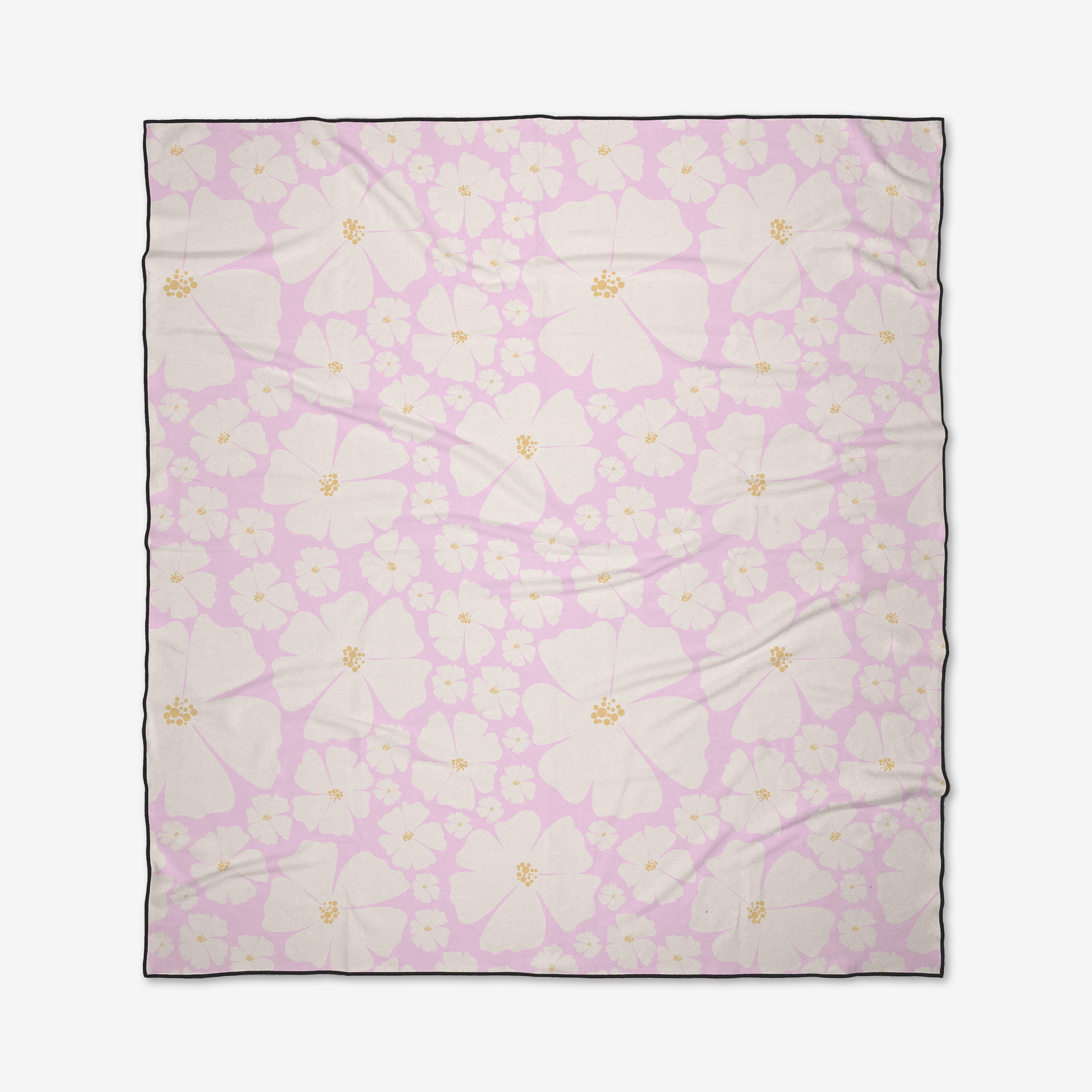 The Daisy Girl Pink beach blanket by Charlie Rowan Designs features a quick-drying fabric with a light pink background, large and small white flowers with yellow centers, and a thin black border.