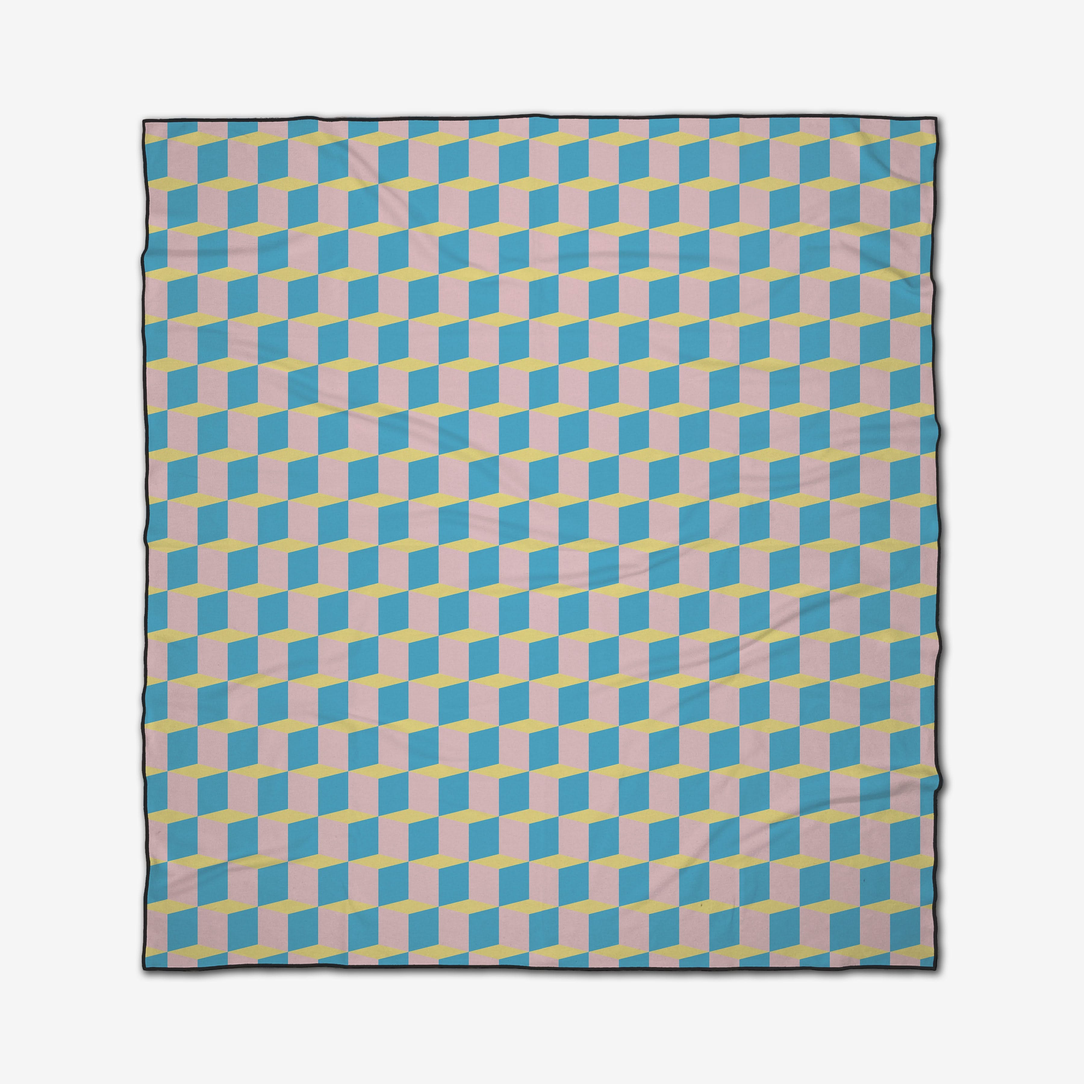 The GEOMETRY “Math Class” beach blanket is quick-drying and features a striking, three-dimensional optical illusion of interlocking blue, yellow, and light pink cubes on a white background.