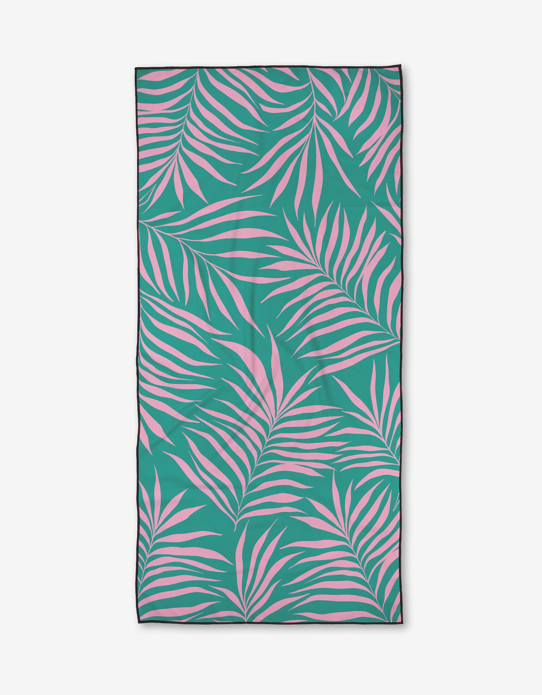 The Bailey Peyton Brave beach towel features a green base with pink palm leaves, crafted from recycled materials and finished with a slim black border.